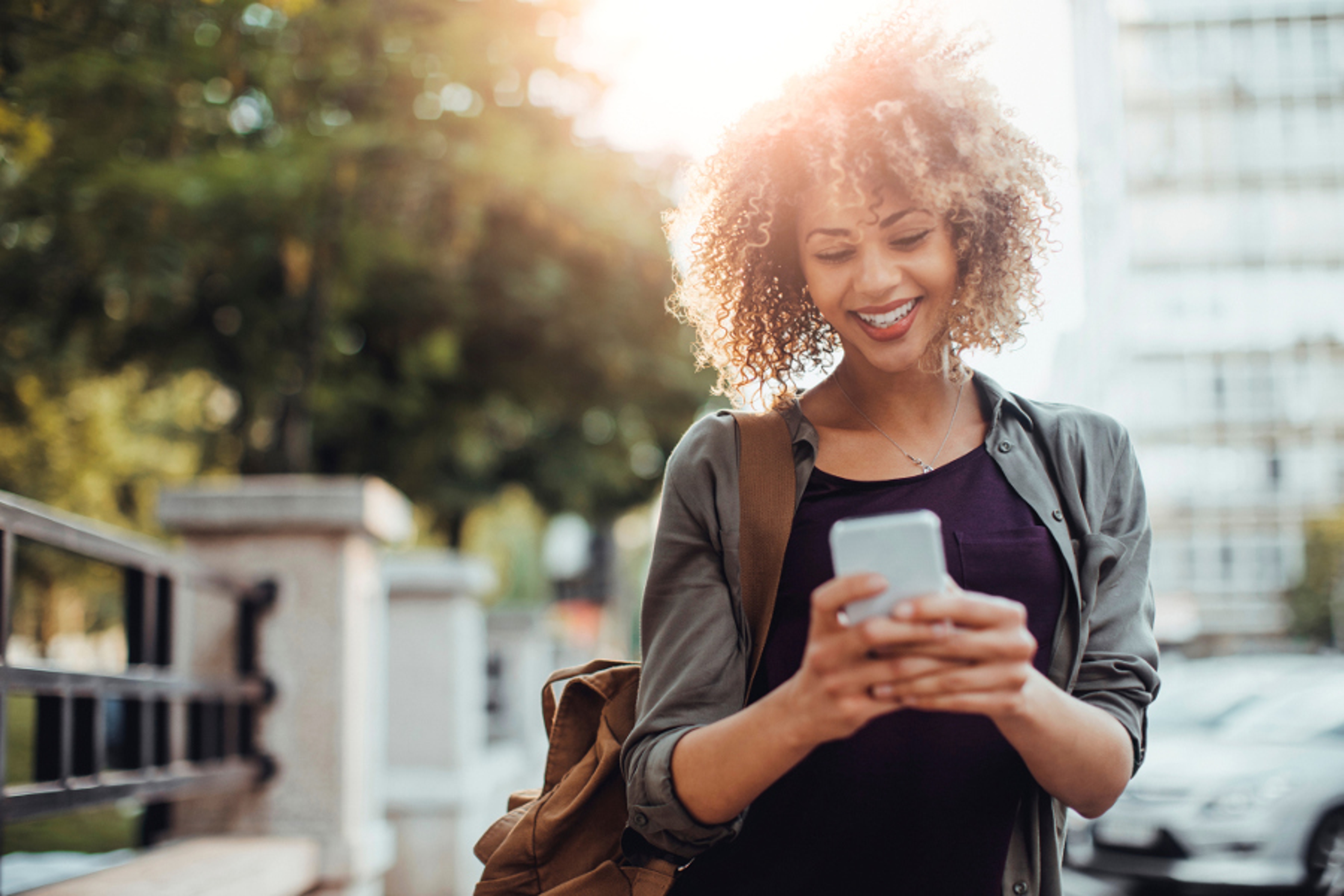 Article Cards Featured Image woman using smartphone