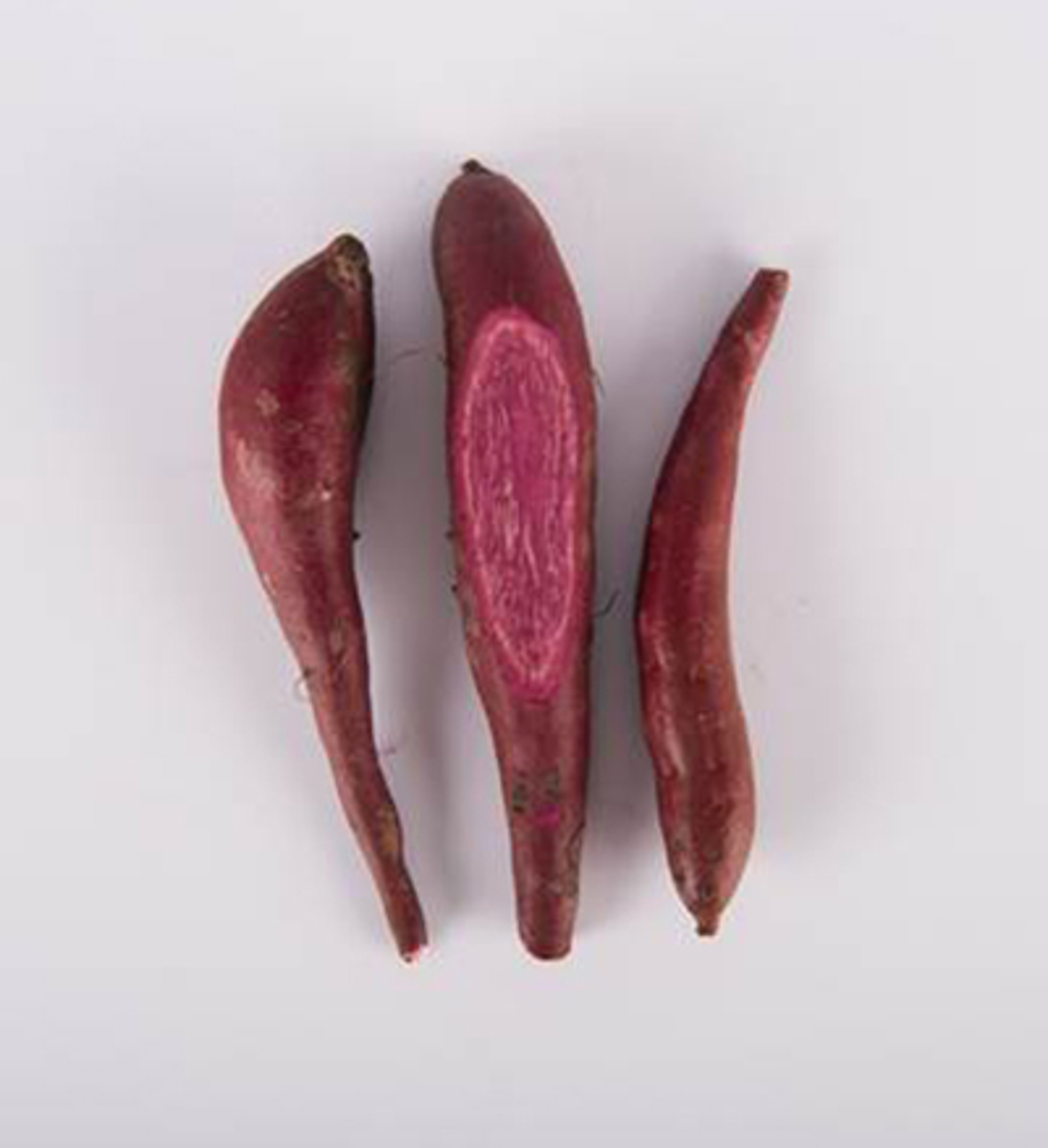 Crown jewel sweet potatoes on a white background.