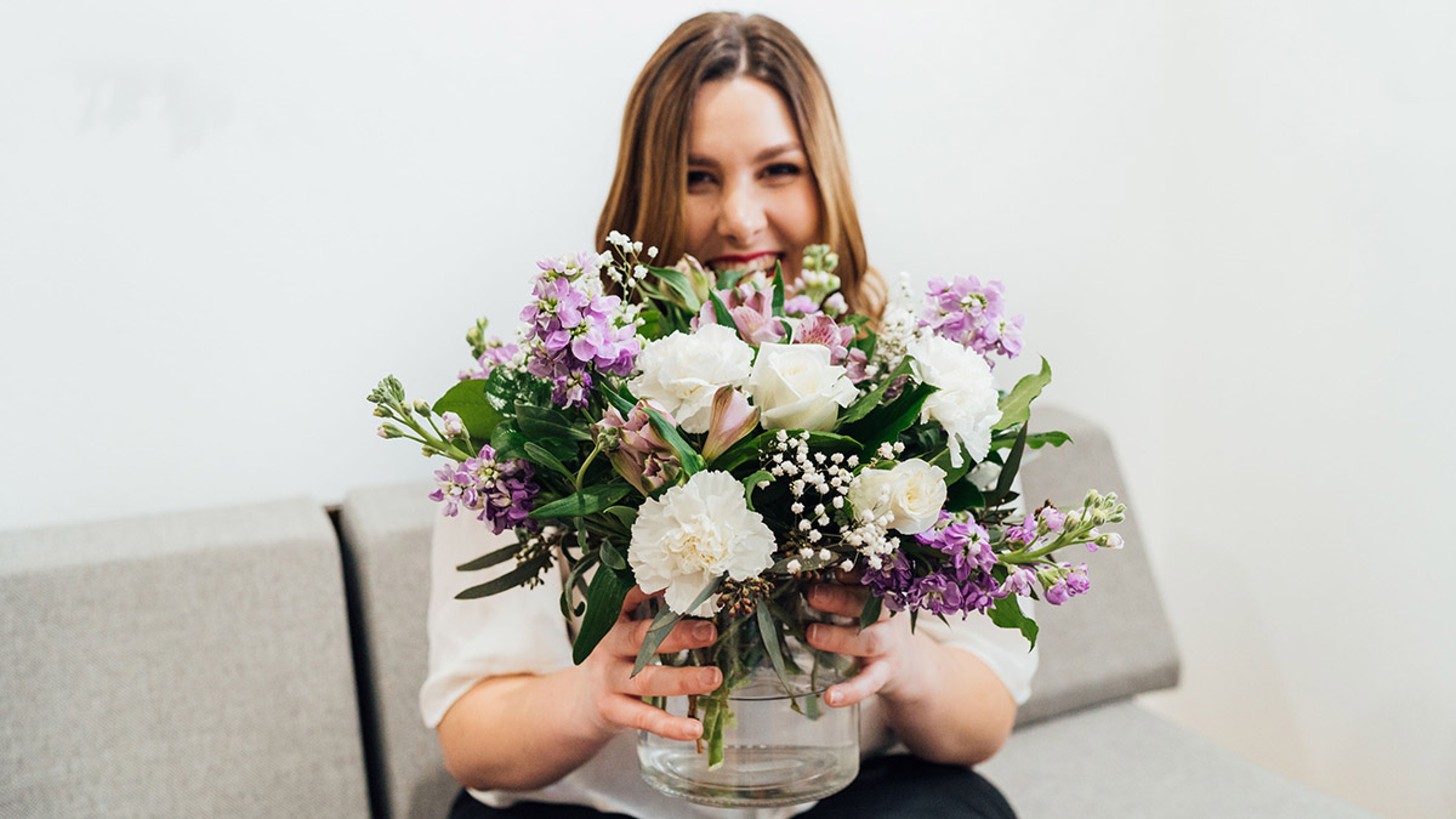 birthday gifts for gemini with women holding lavender bouquet