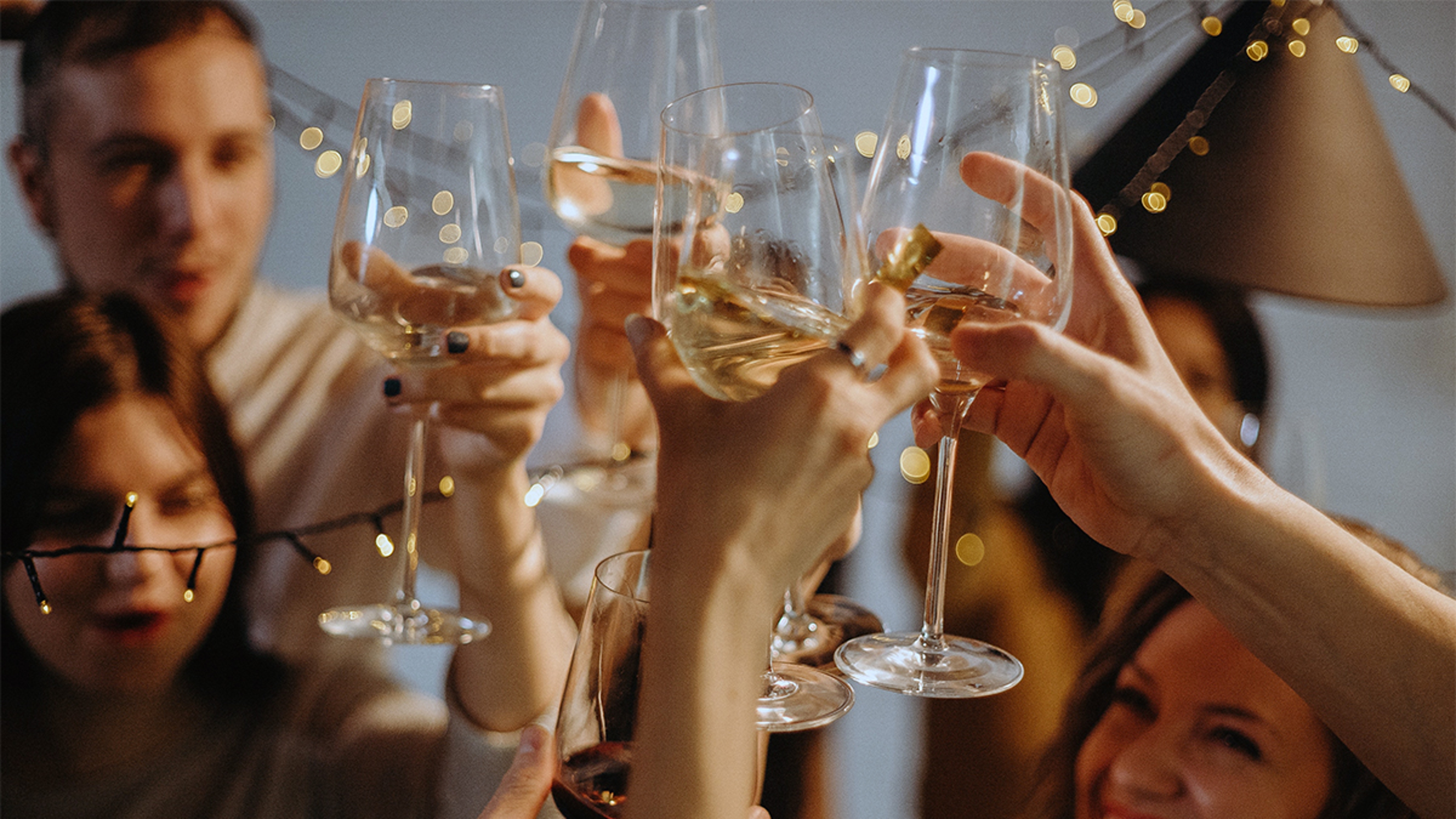 a photo of a surprise birthday party: friends toasting at a party