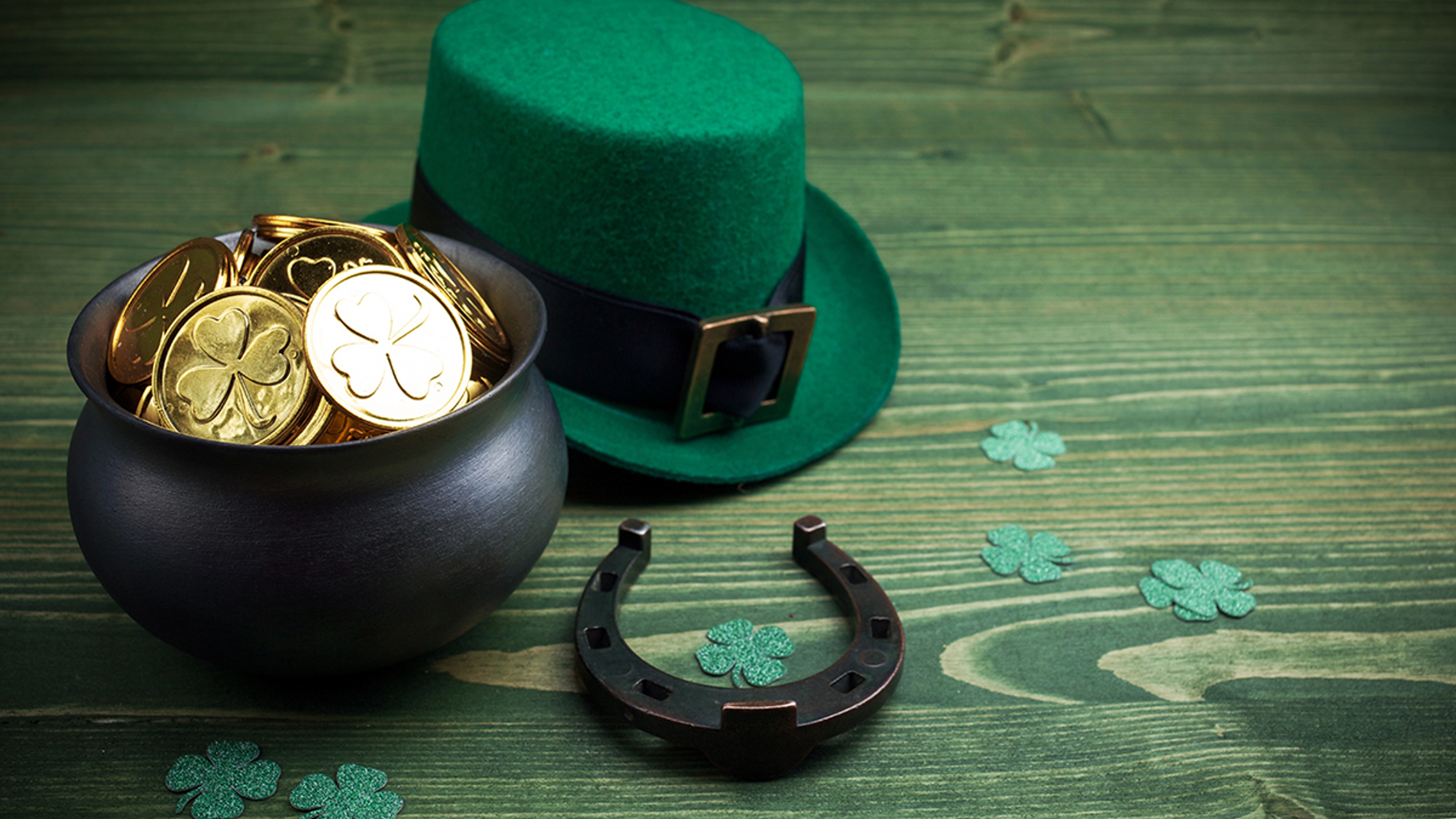 Article Cards Featured Image Happy St Patricks Day leprechaun hat with gold coins and lucky charms on vintage style green wood