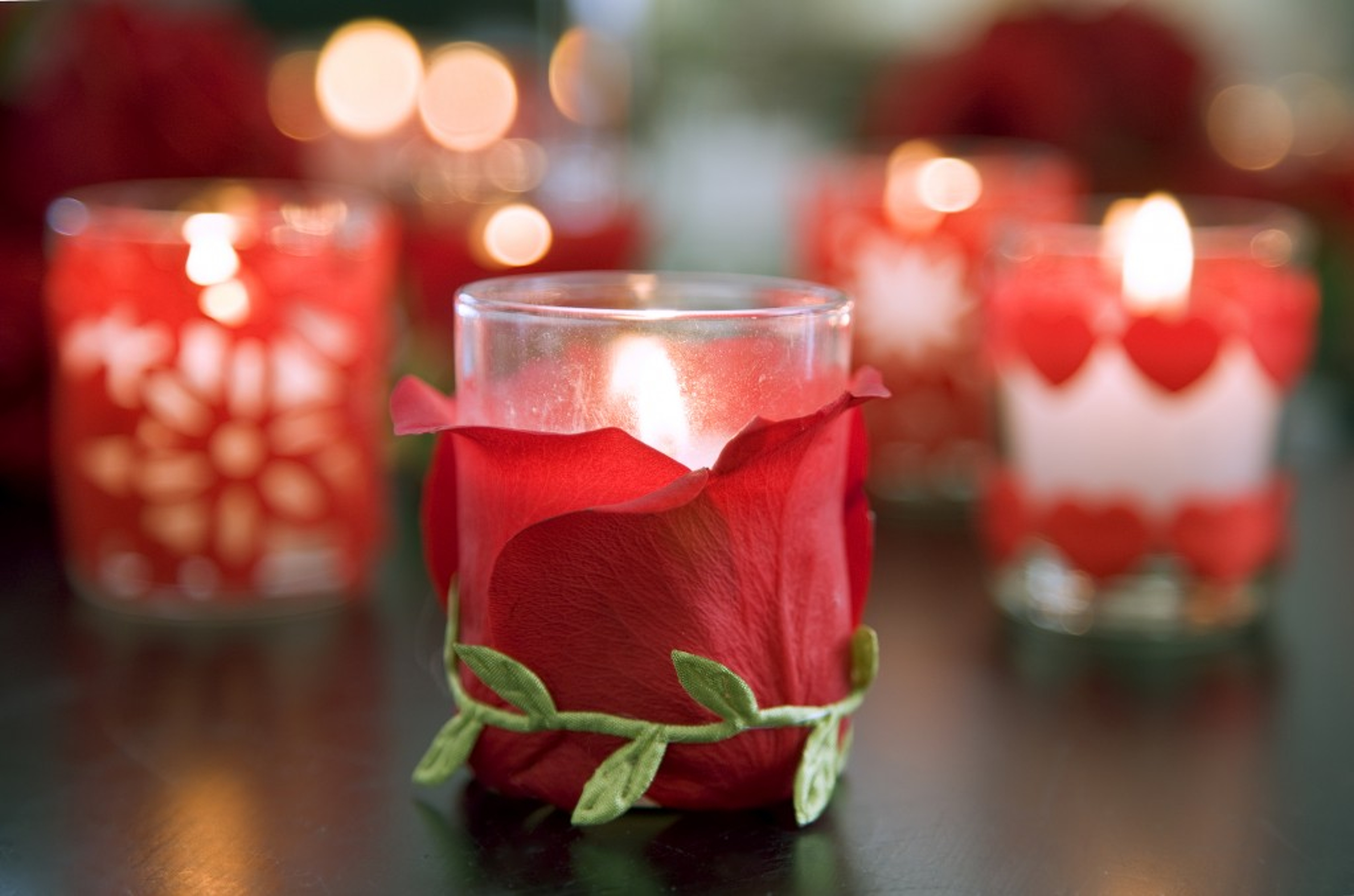 Make your Valentine's Day Flowers last with petal covered votive candles.