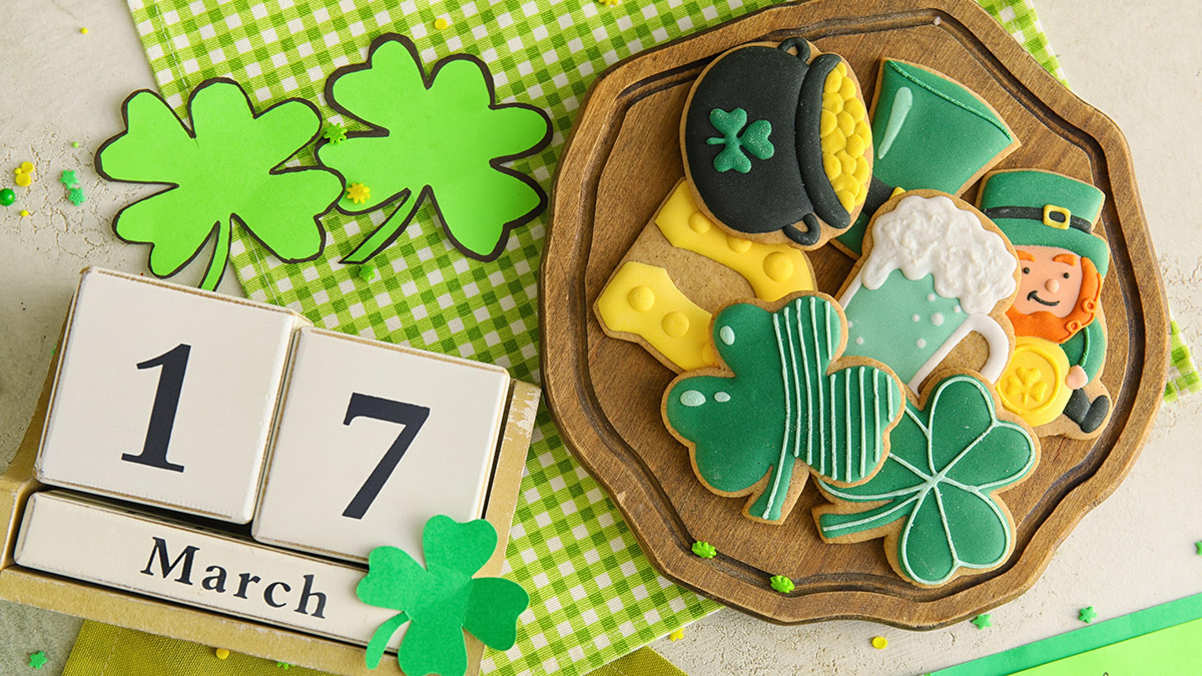 History of St. Patrick's Day with a plate of themed cookies.