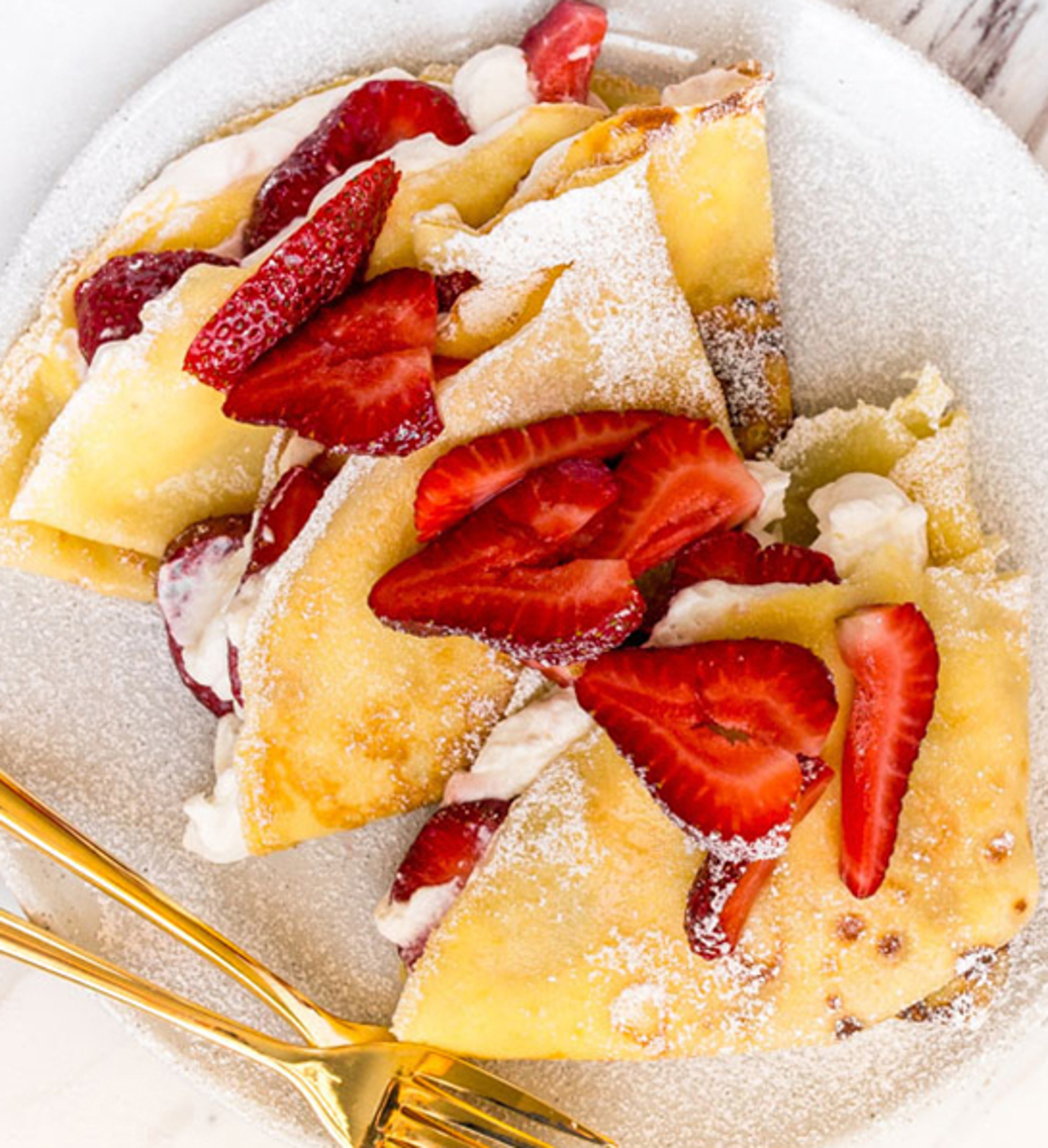 Plate of strawberry crepes