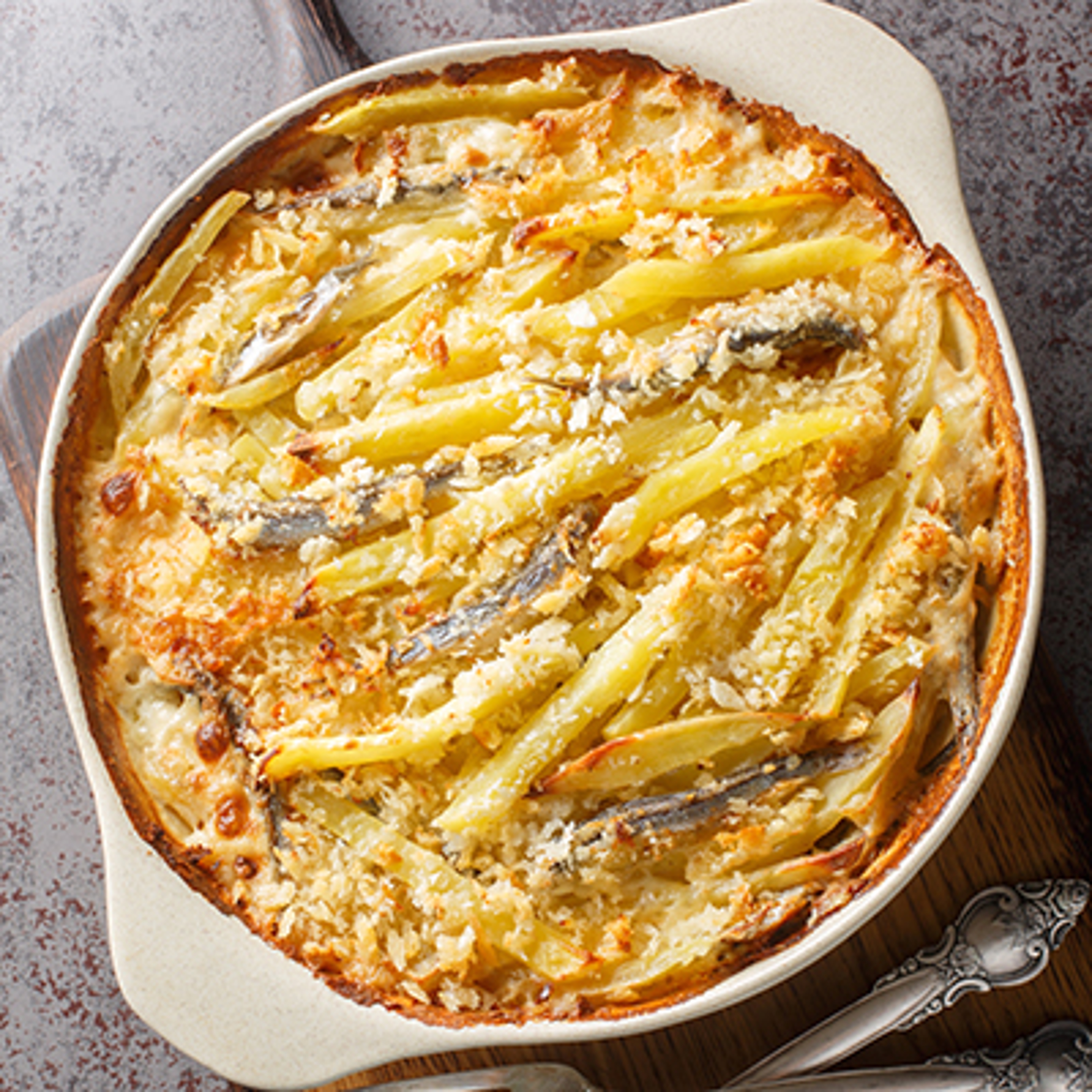 Janssons frestelse casserole consists of potatoes and anchovies