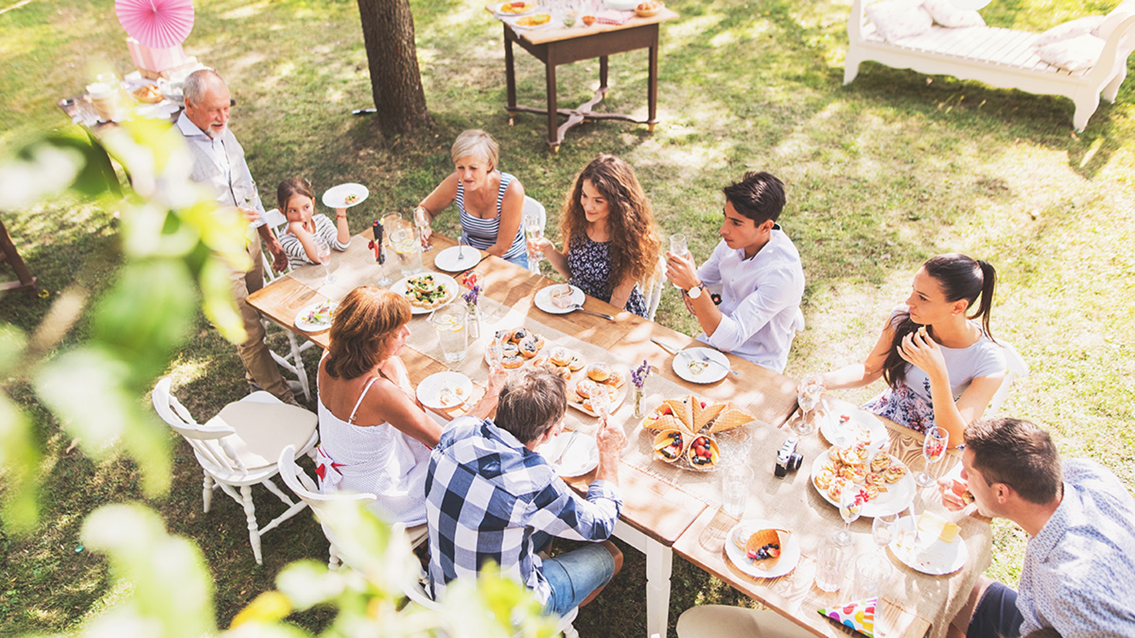 Article Cards Featured Image Family celebration or a garden party outside in the backyard.