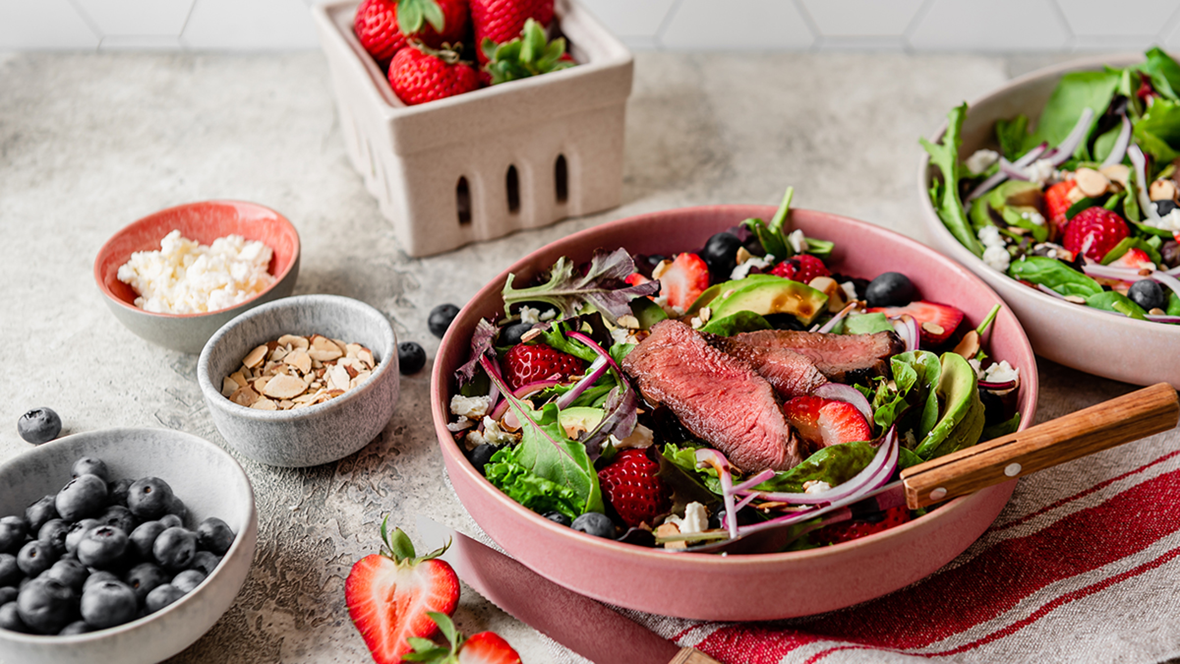 Article Cards Featured Image Photo of steak salad with strawberries onions avocado and greens