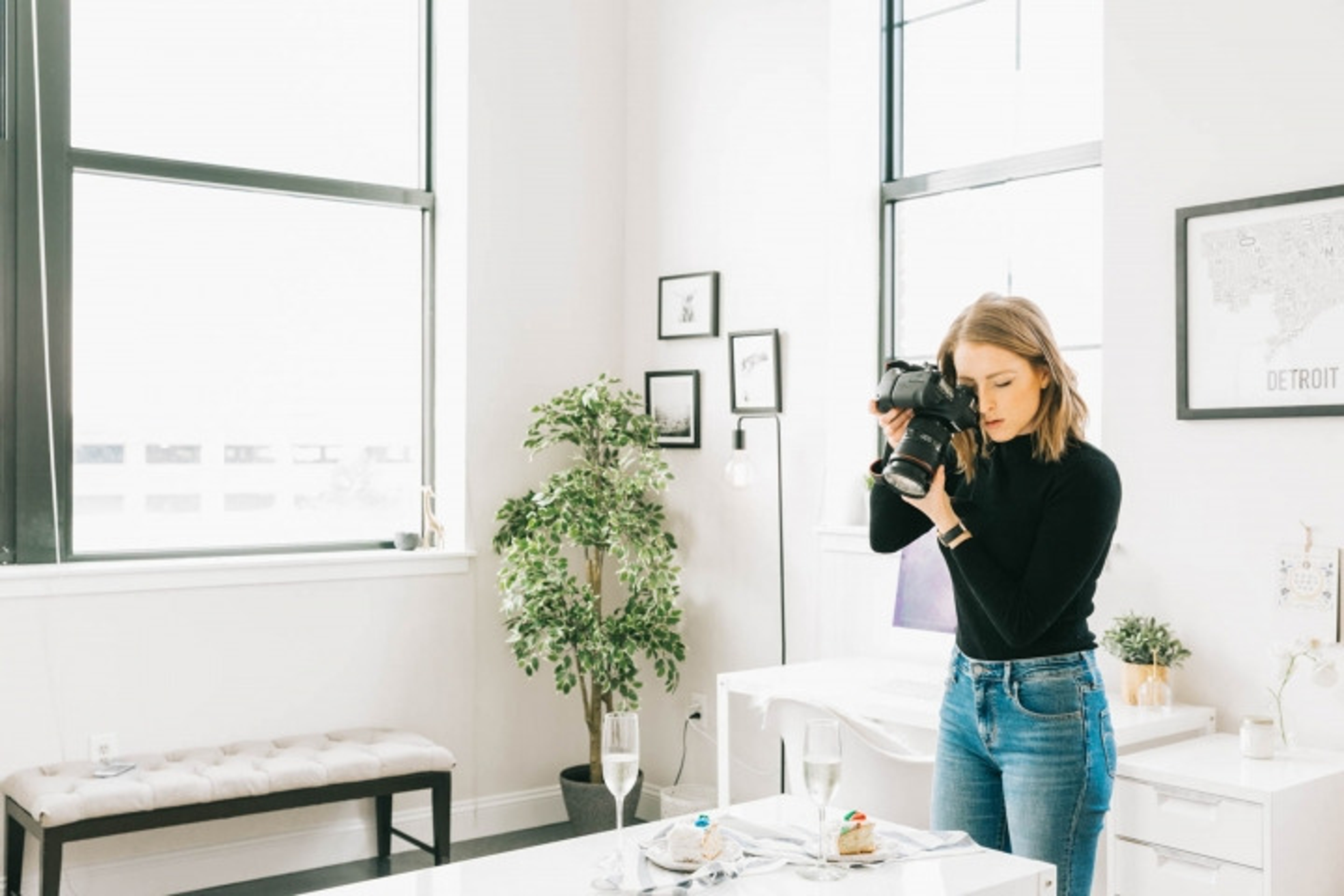 Sarah Crawford, founder of Broma Bakery, taking a picture of food