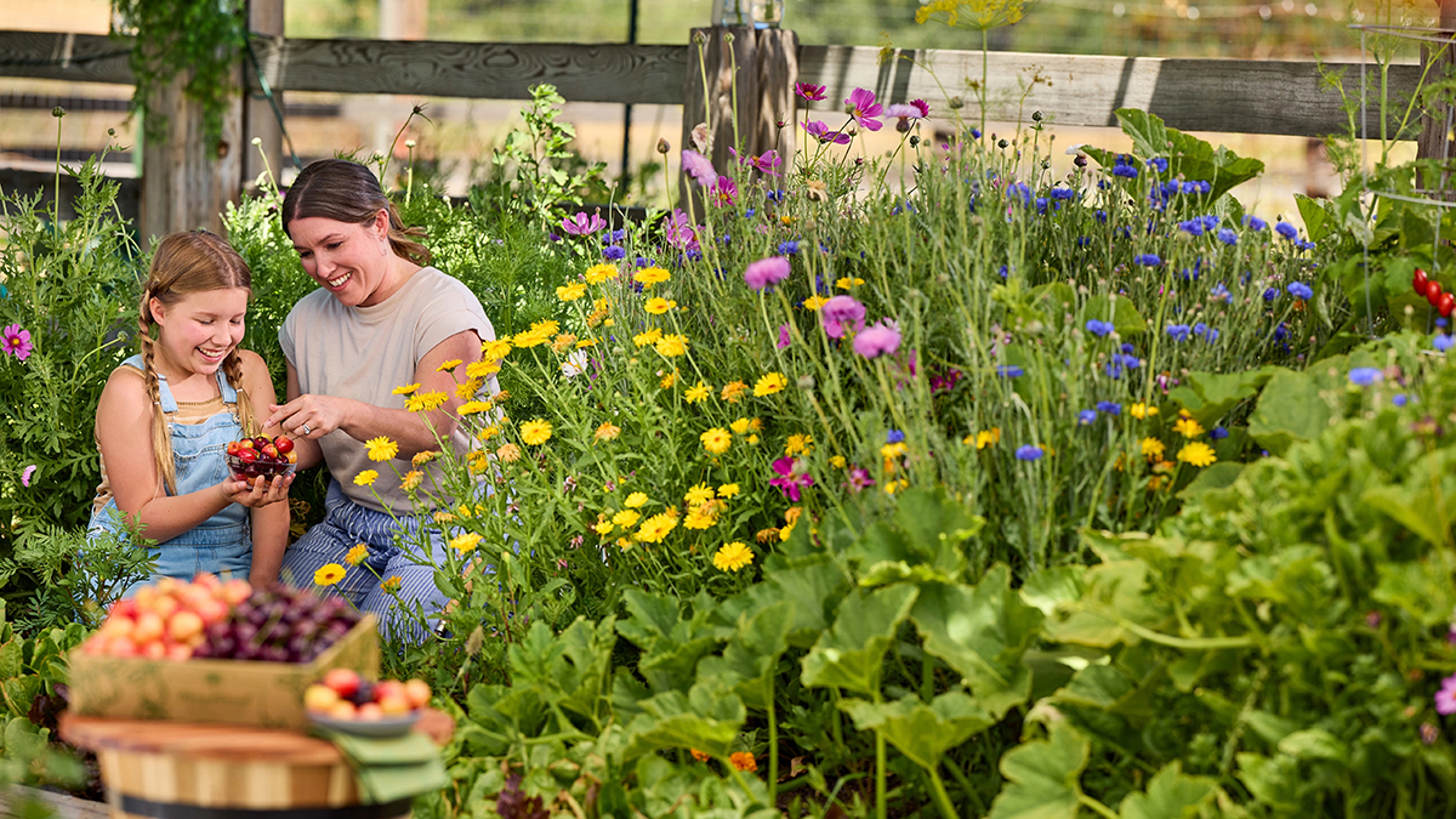 Woman and daughter gardening.