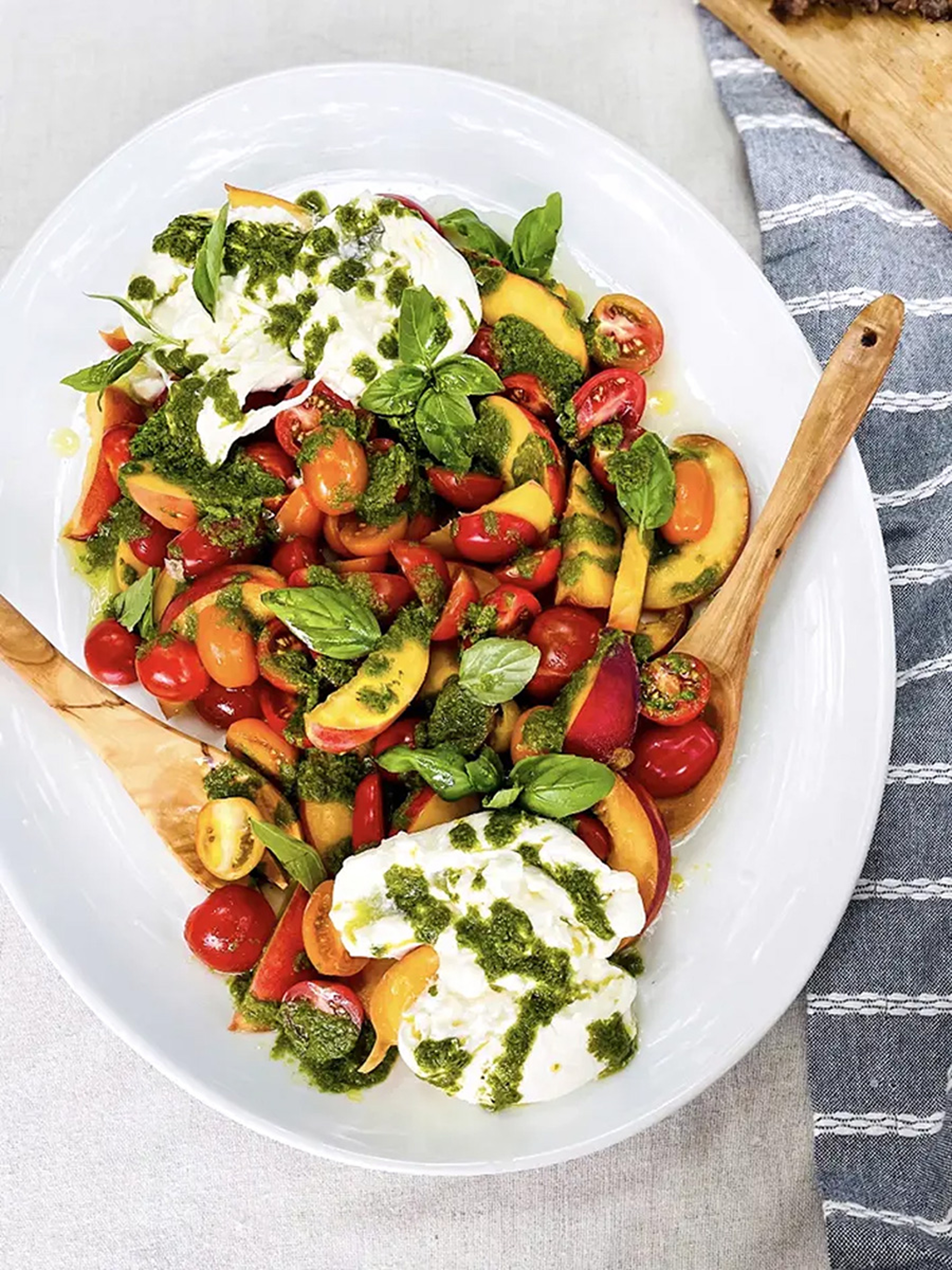 Tomato and peach salad in a dish.