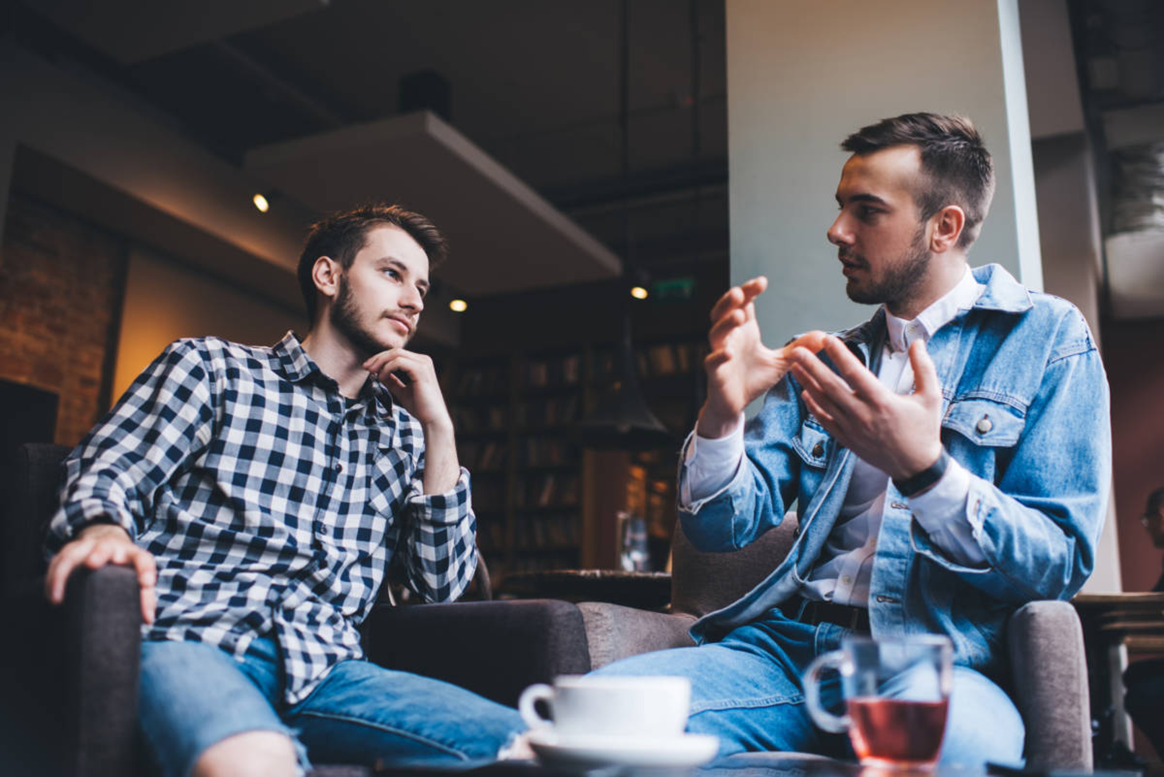 Article Cards Featured Image Young men having a serious conversation