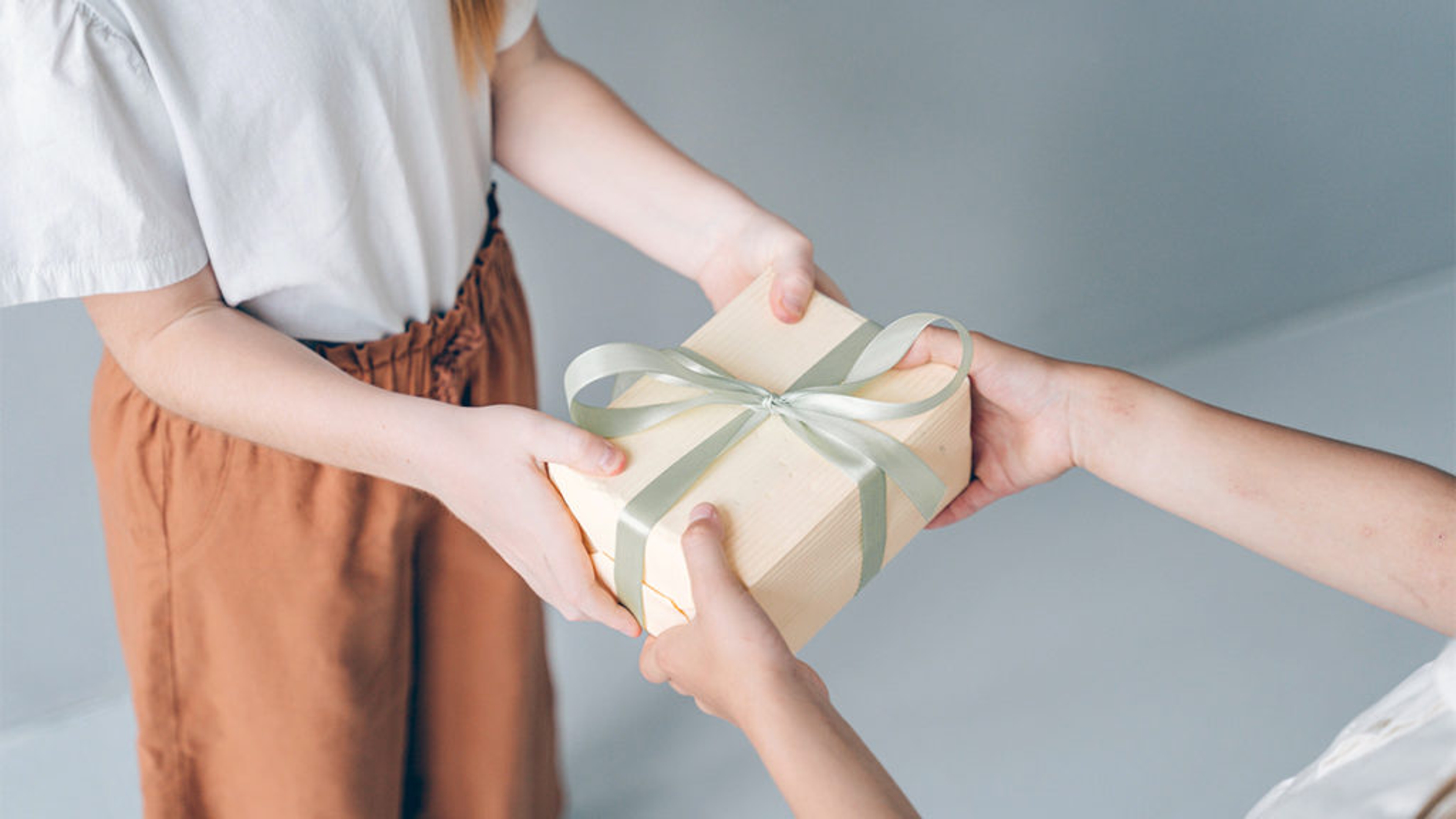 Two children swapping a gift.