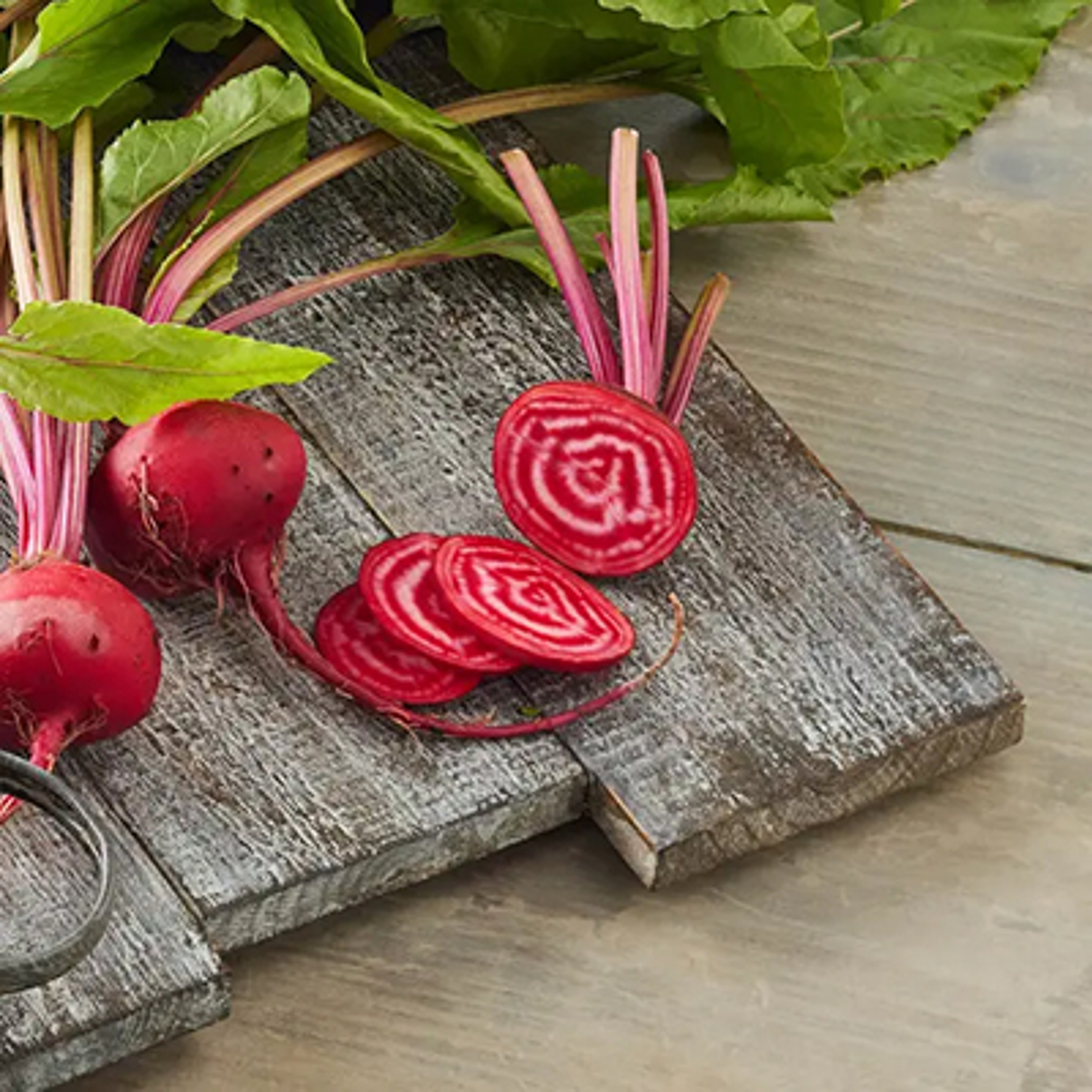 Cross section of candy cane beets on a cutting board