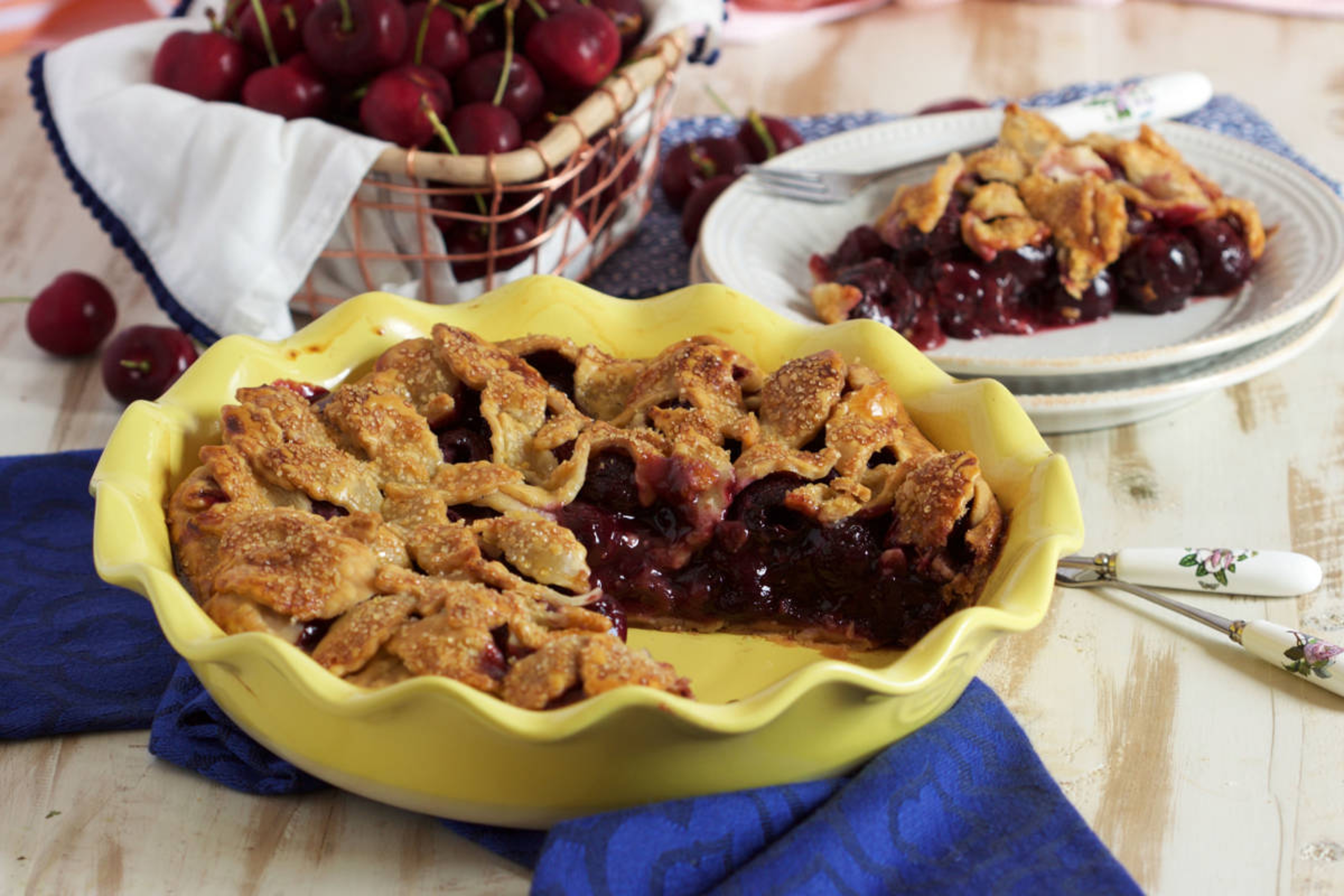 Cherry facts with a cherry pie on a table.