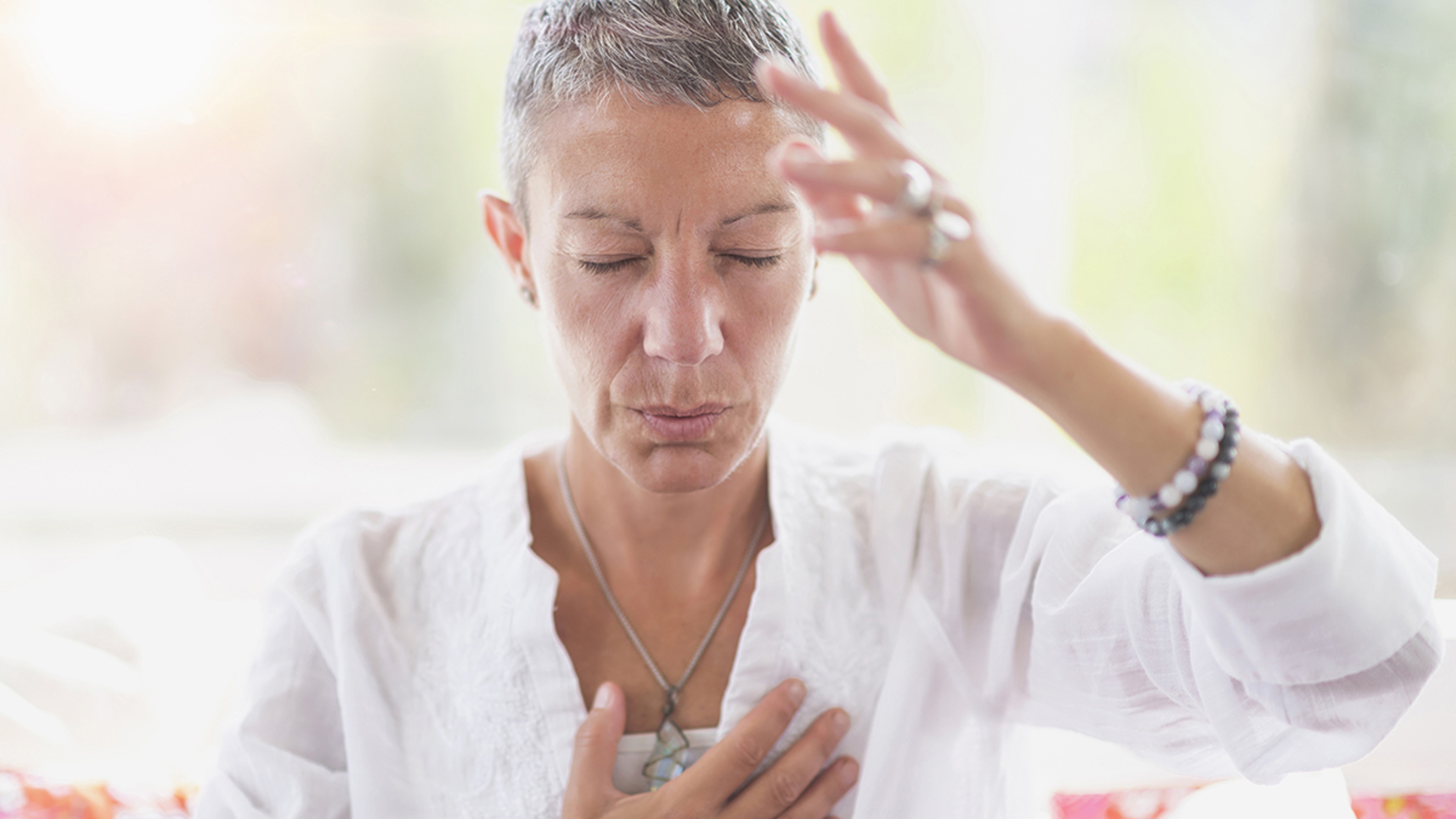 Article Cards Featured Image Mindful woman meditating, developing intuition.