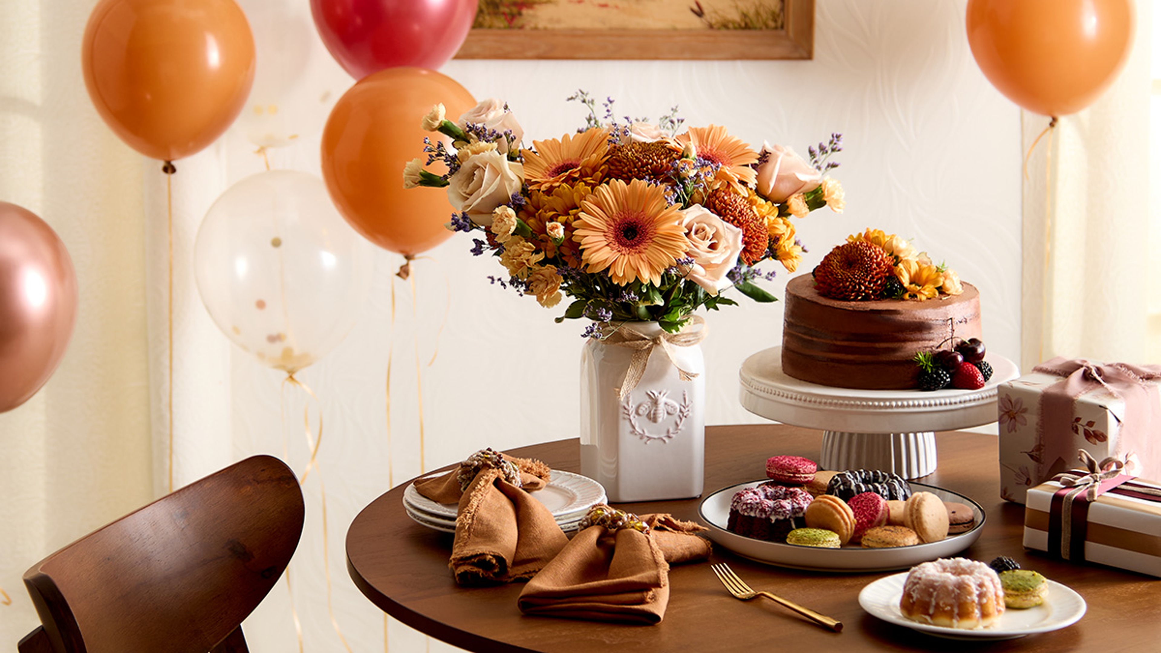 Spread of cake and flowers for September birthdays.