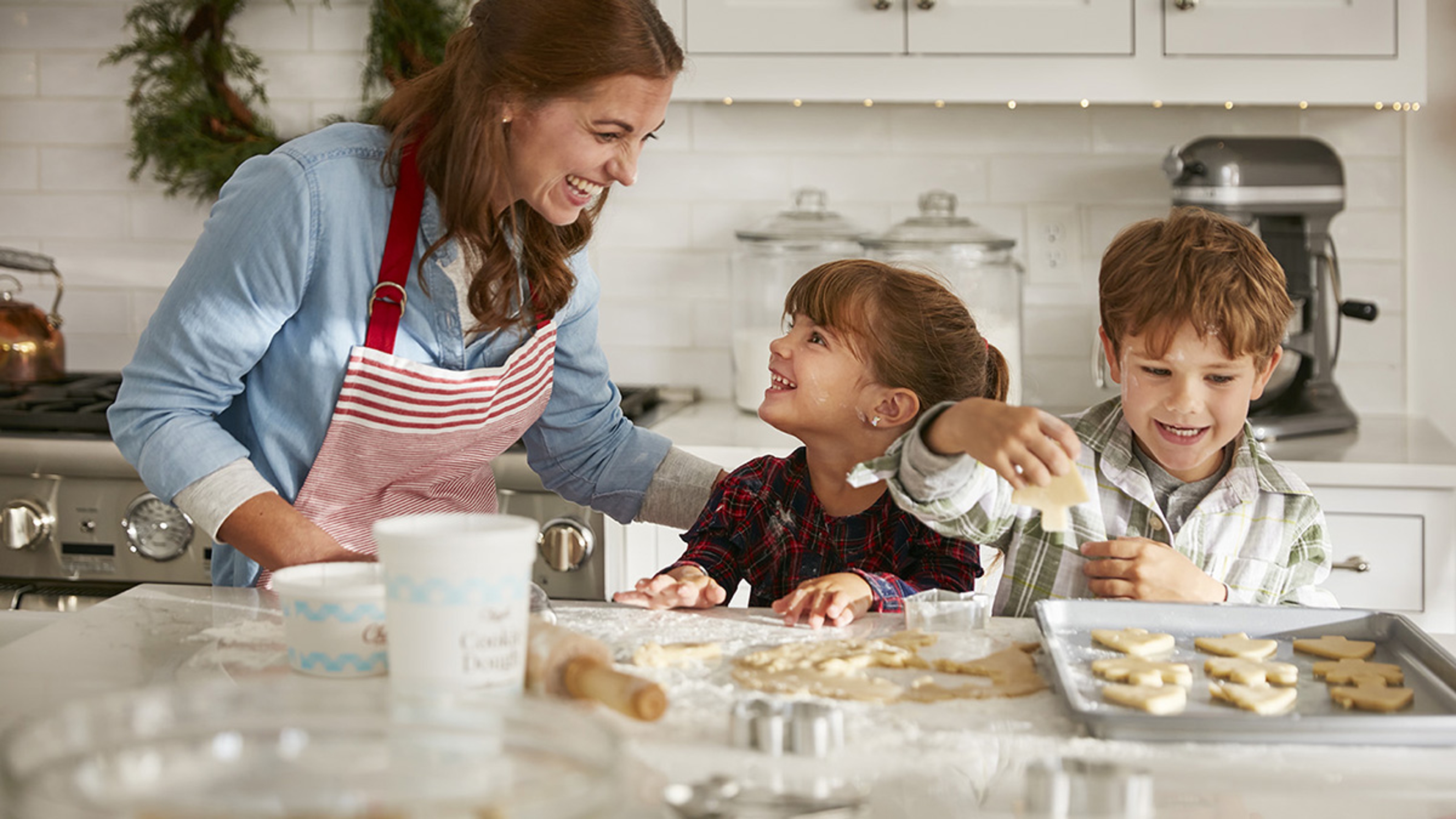 Article Cards Featured Image mom and kids making holiday cookies