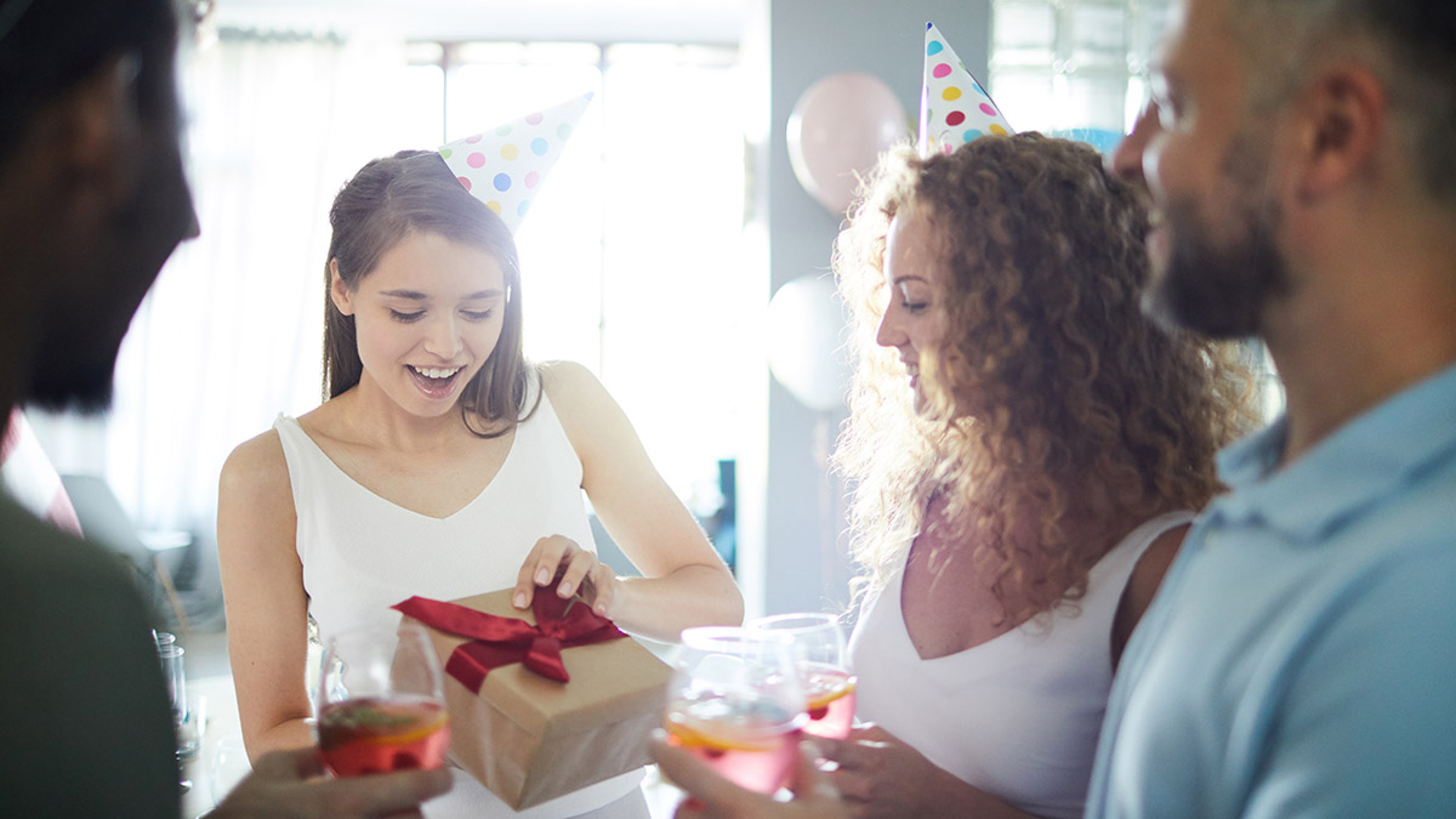 Article Cards Featured Image birthday gifts for scorpio woman opening present