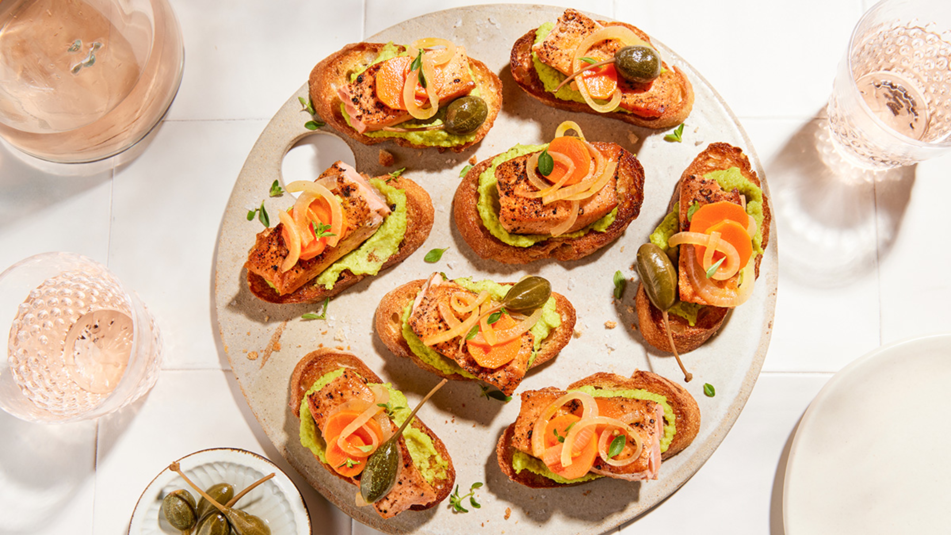 Alaskan Coho salmon on toasted baguettes with capers and avocado.
