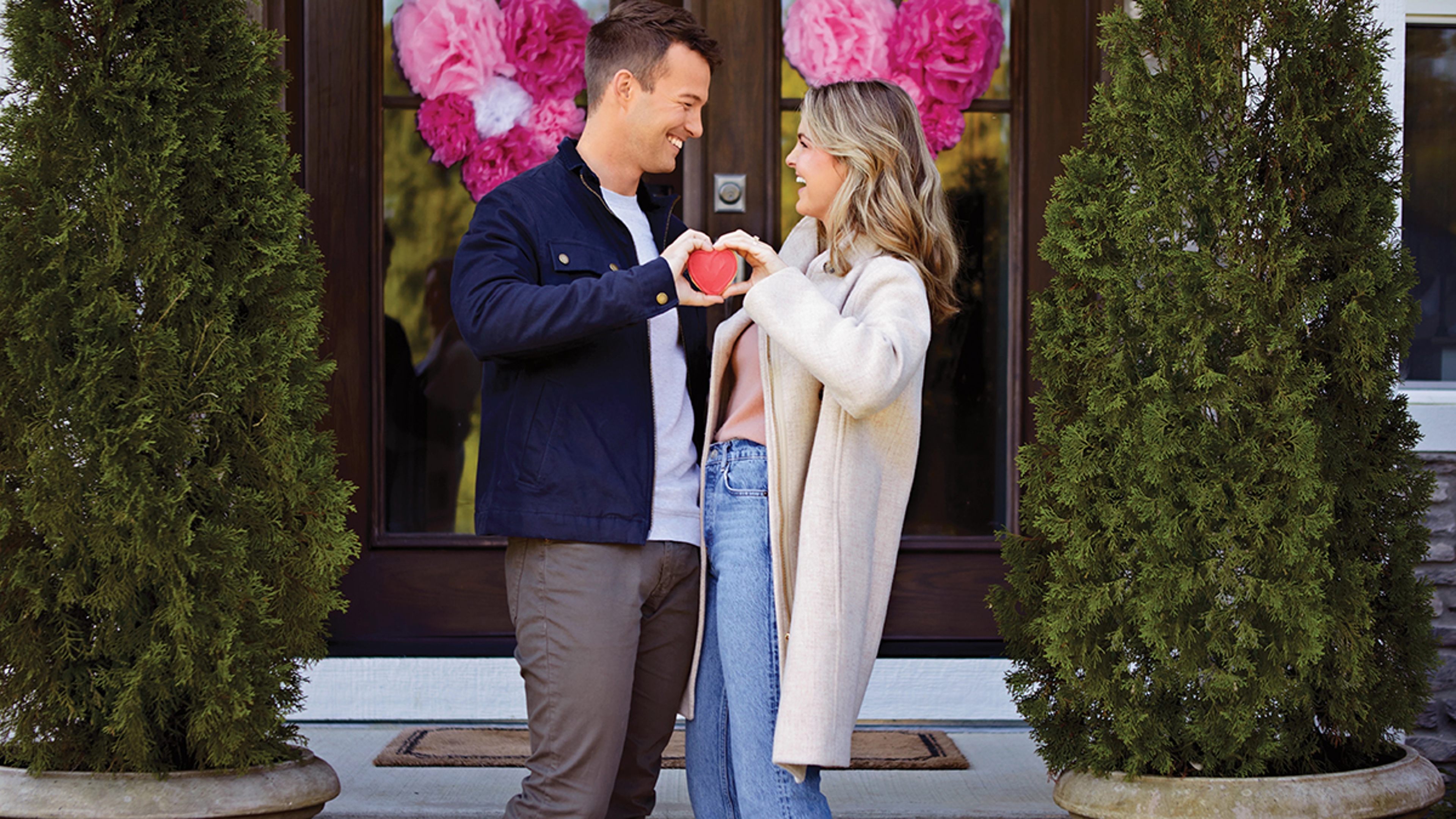 valentine's day gifts for him couple facing each other making a heart with their hands