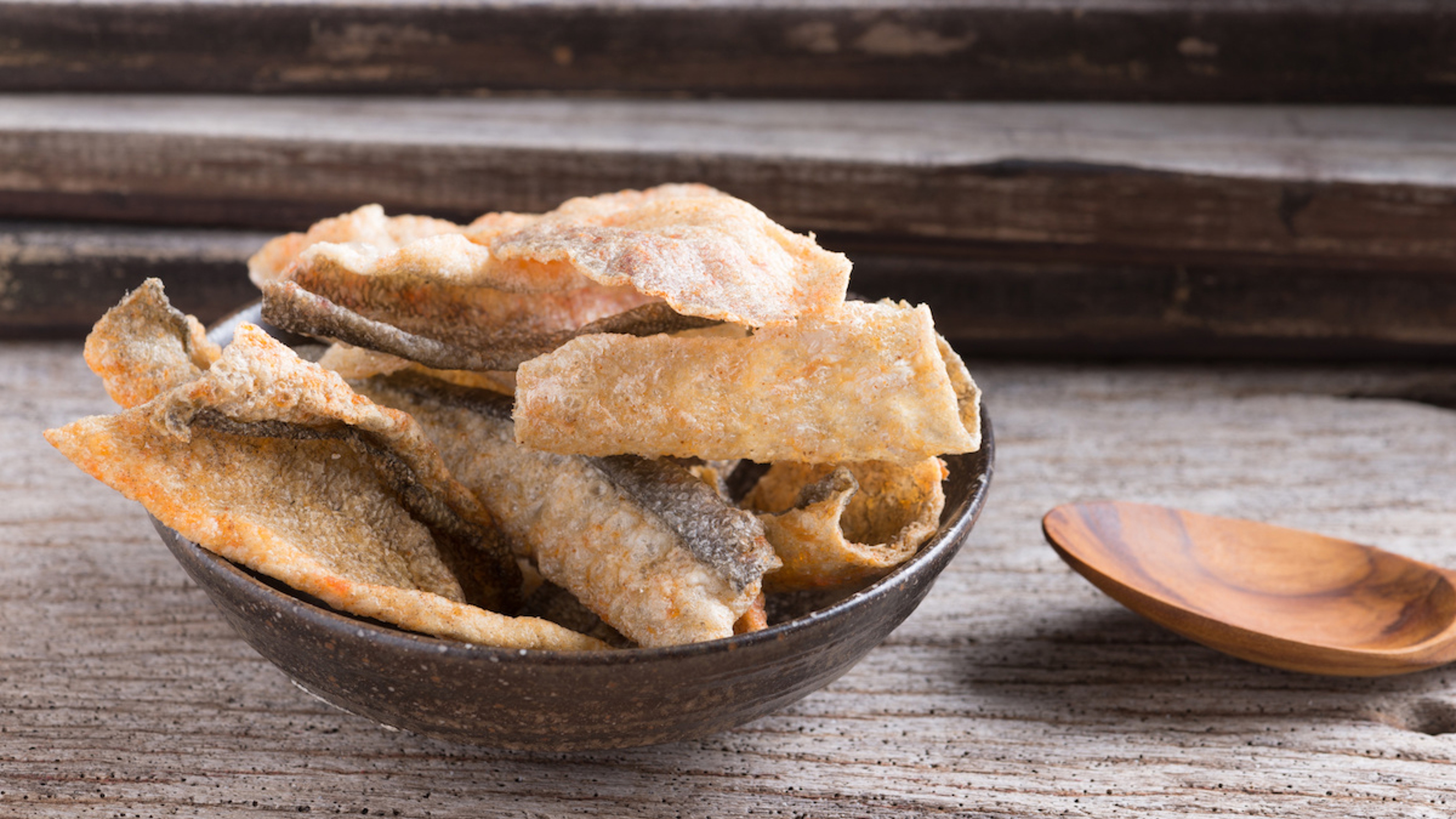 Crispy salmon skin in a bowl.