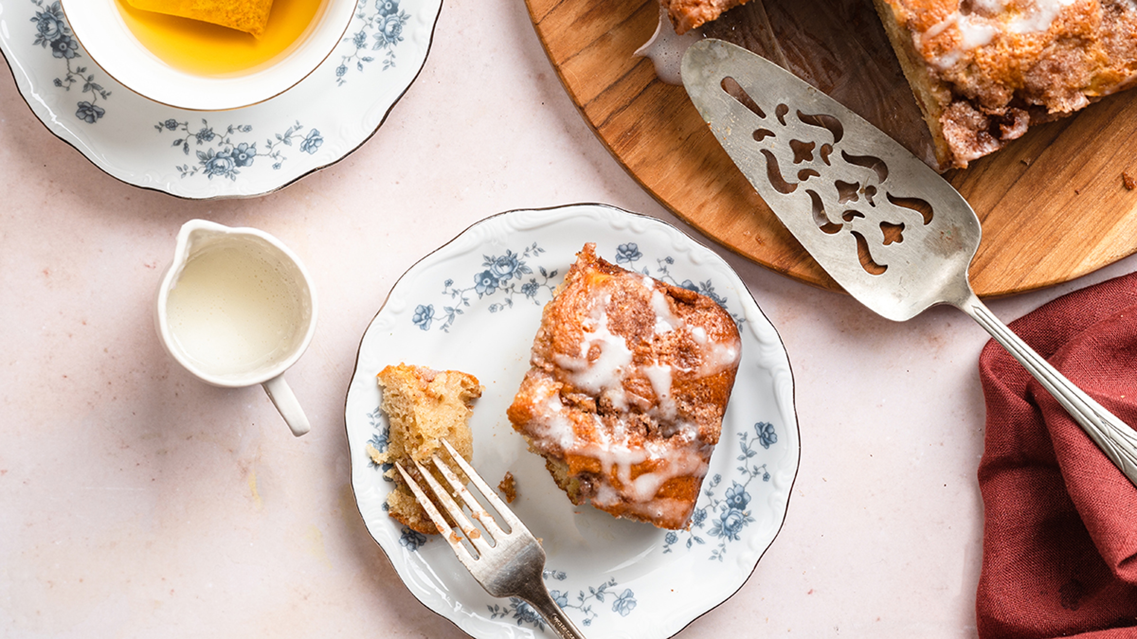 Slice of cinnamon apple cake on a plate.