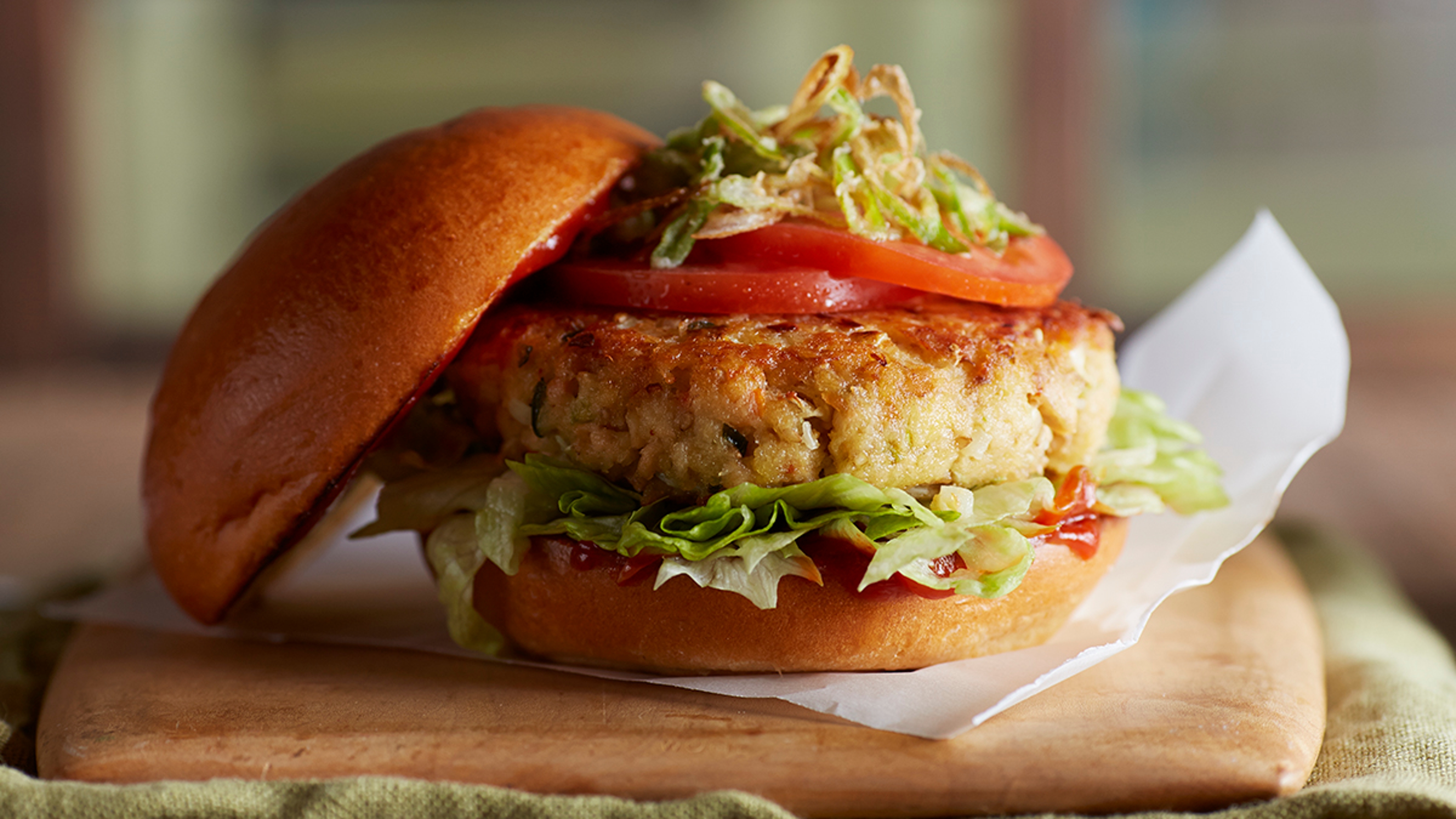 Salmon burger on a plate.