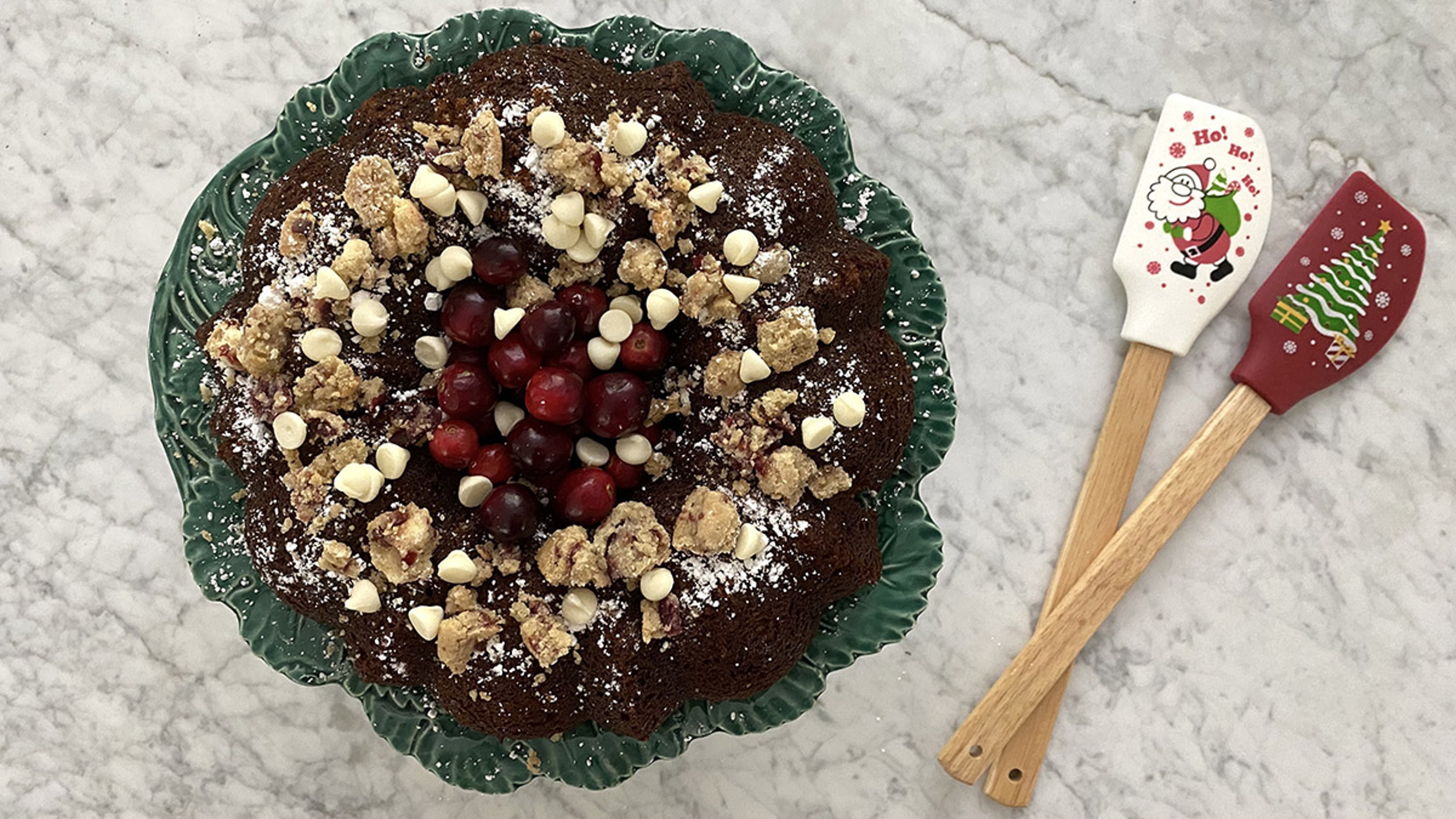 Completed Mandarin Orange Bundt Cake powdered with sugar on a counter