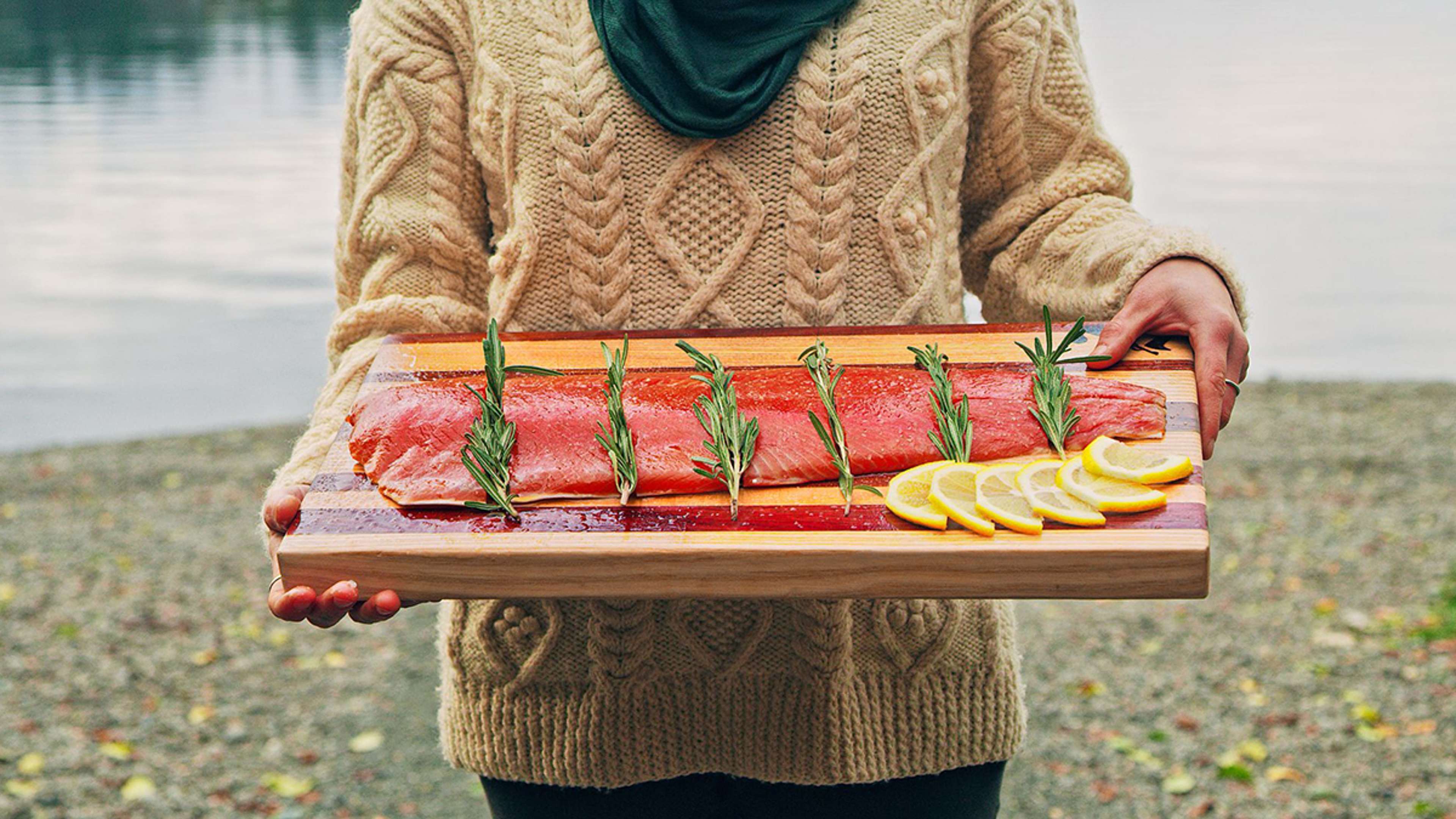 Article Cards Featured Image copper river sockeye woman holding fillet