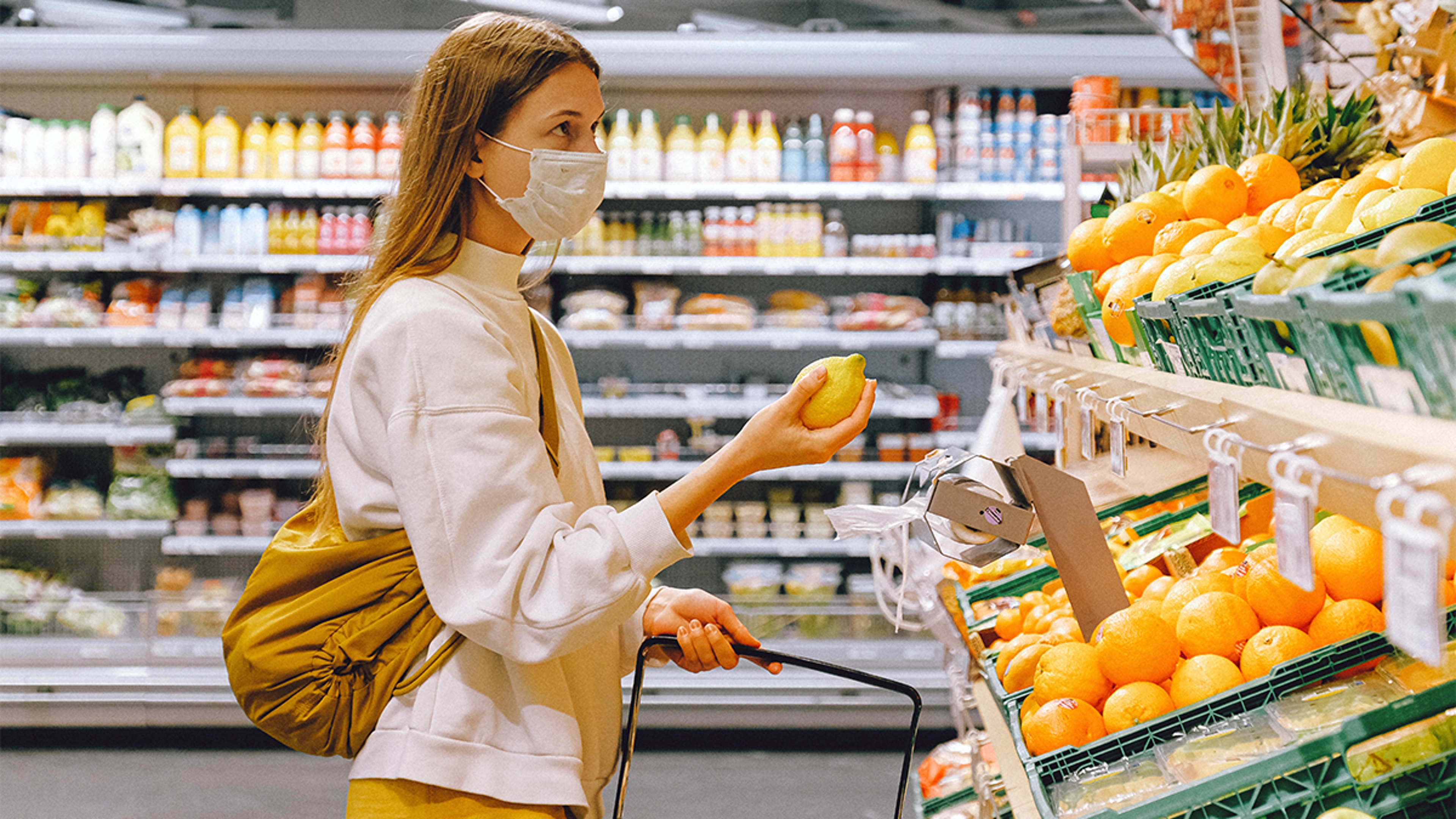 women wearing mask in a grocery store