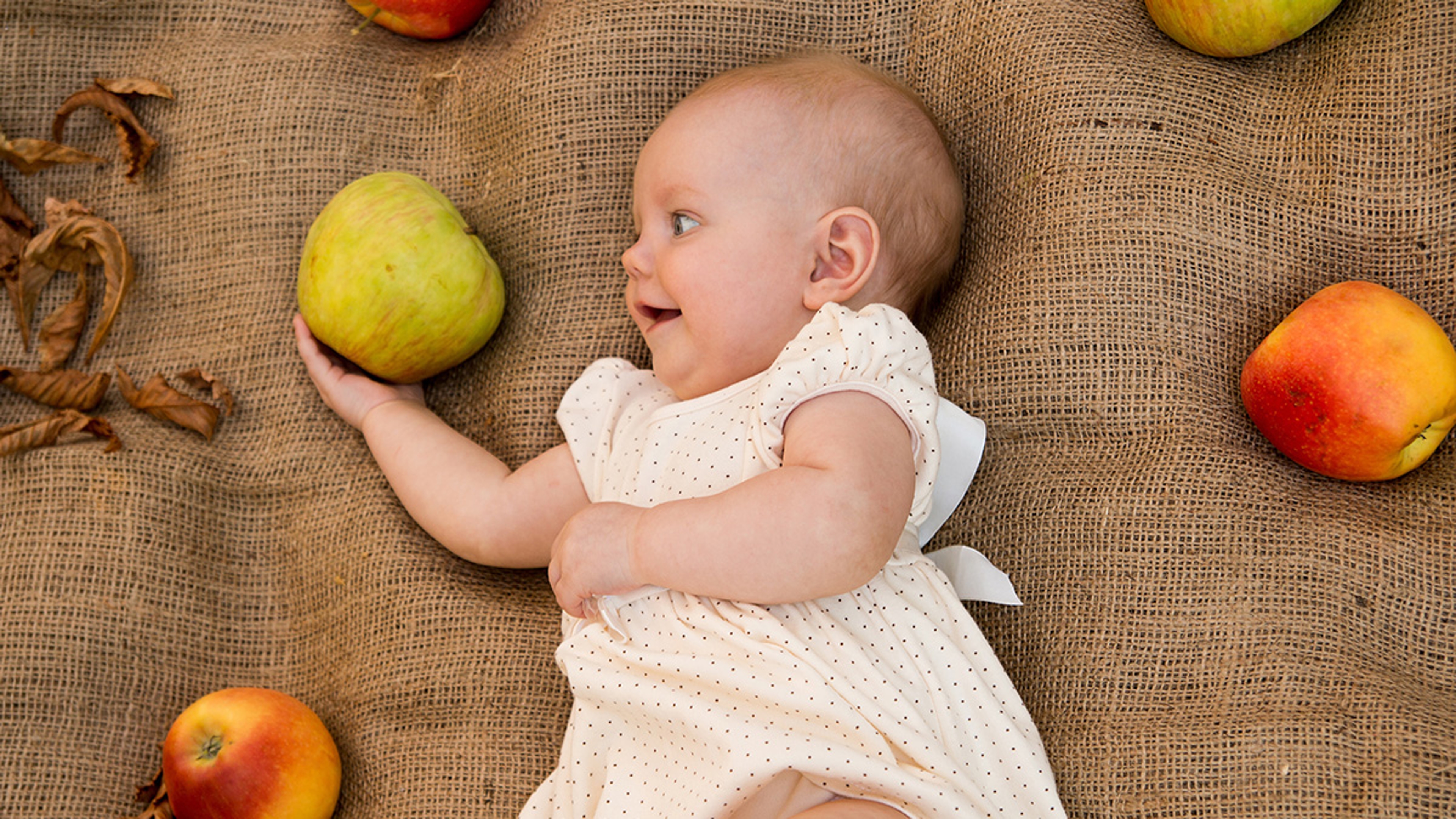 september birthdays baby with apple