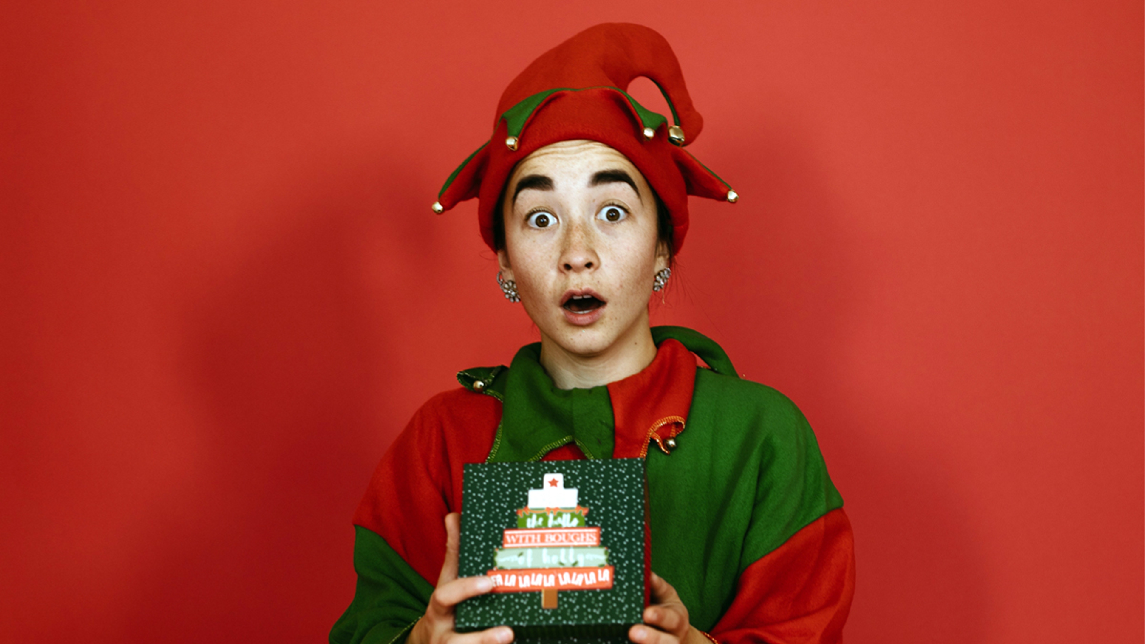 Article Cards Featured Image Christmas elf with gifts