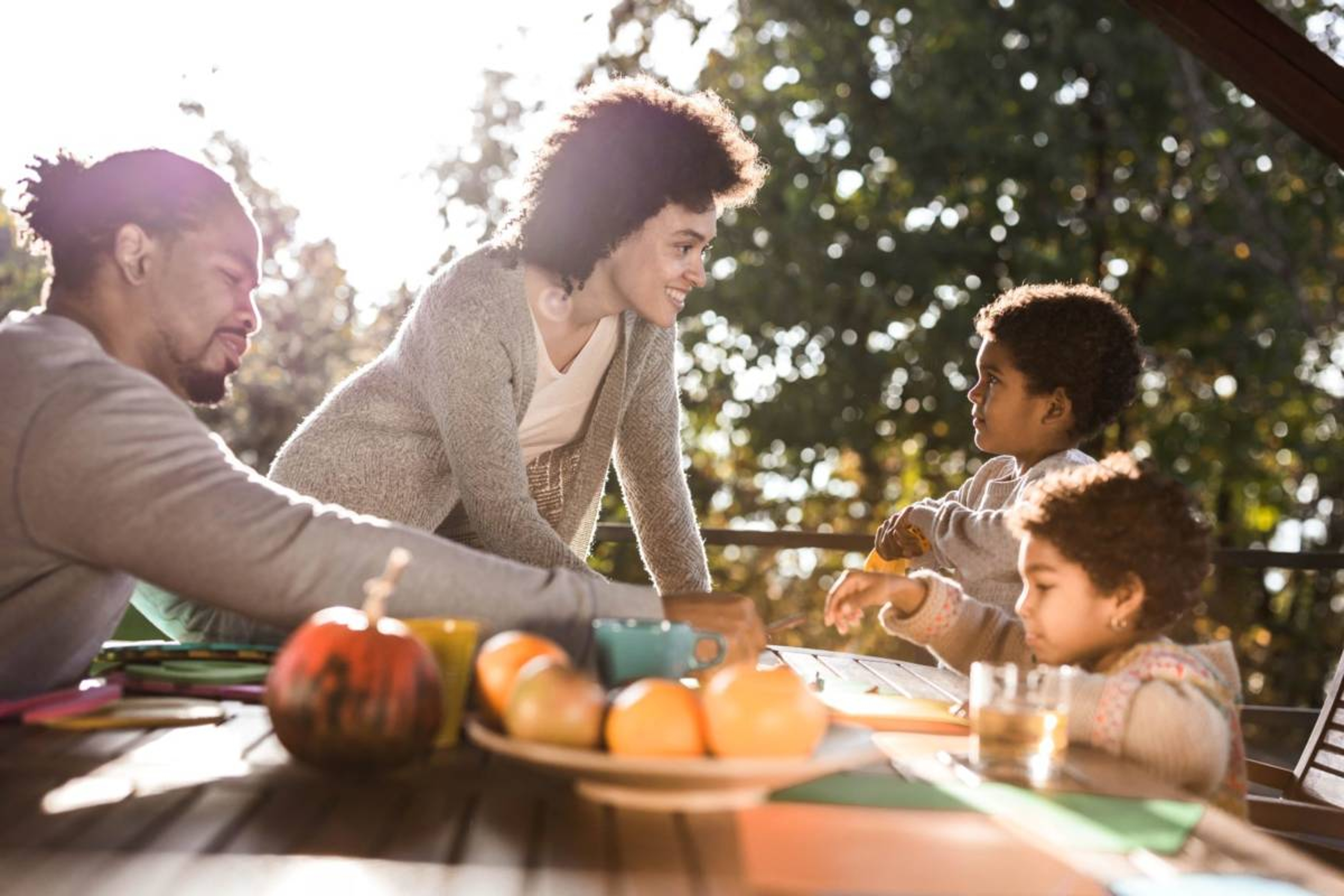 Photo of family playing a game outside