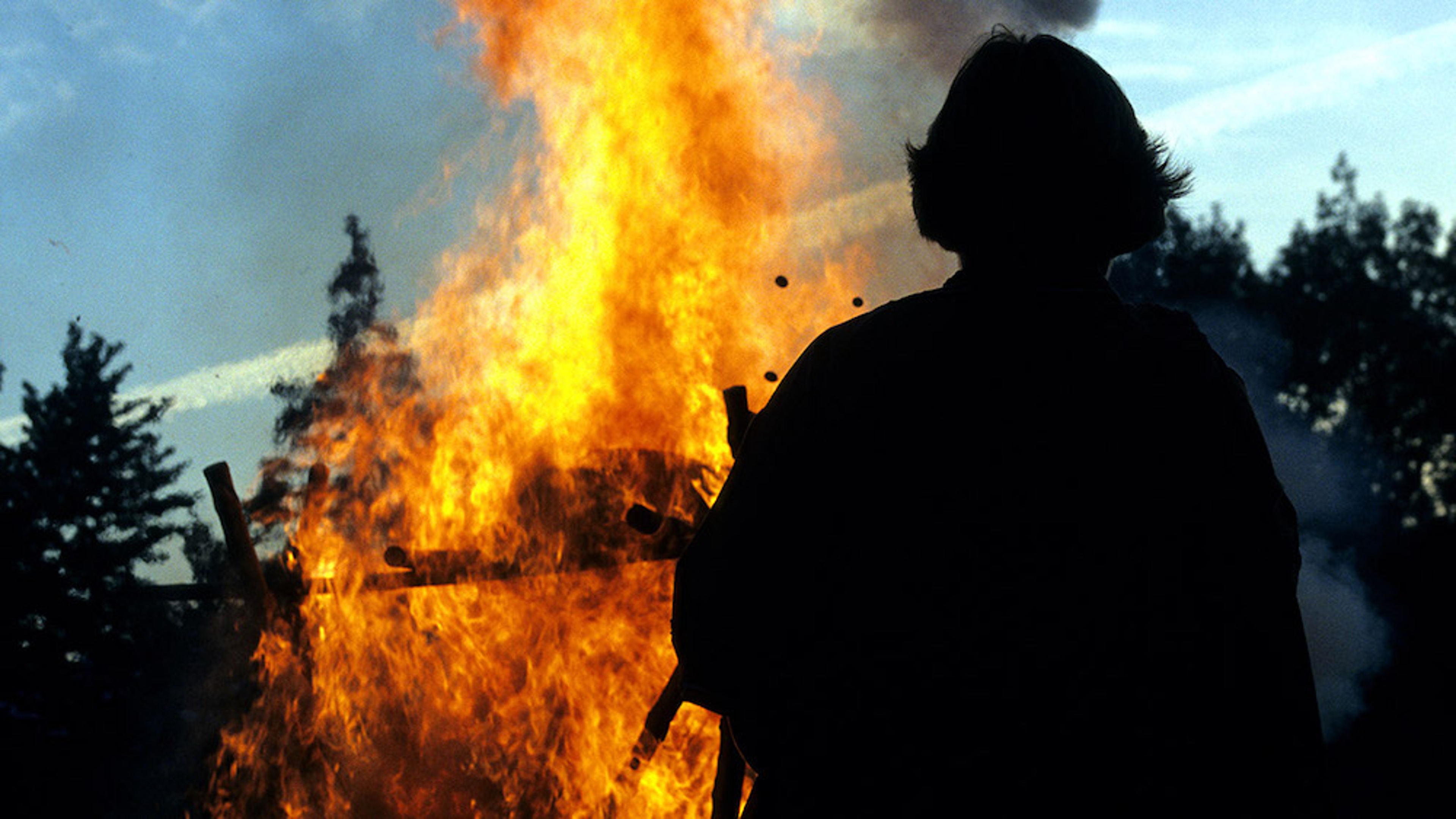 Man's silhouette in front of a cremation