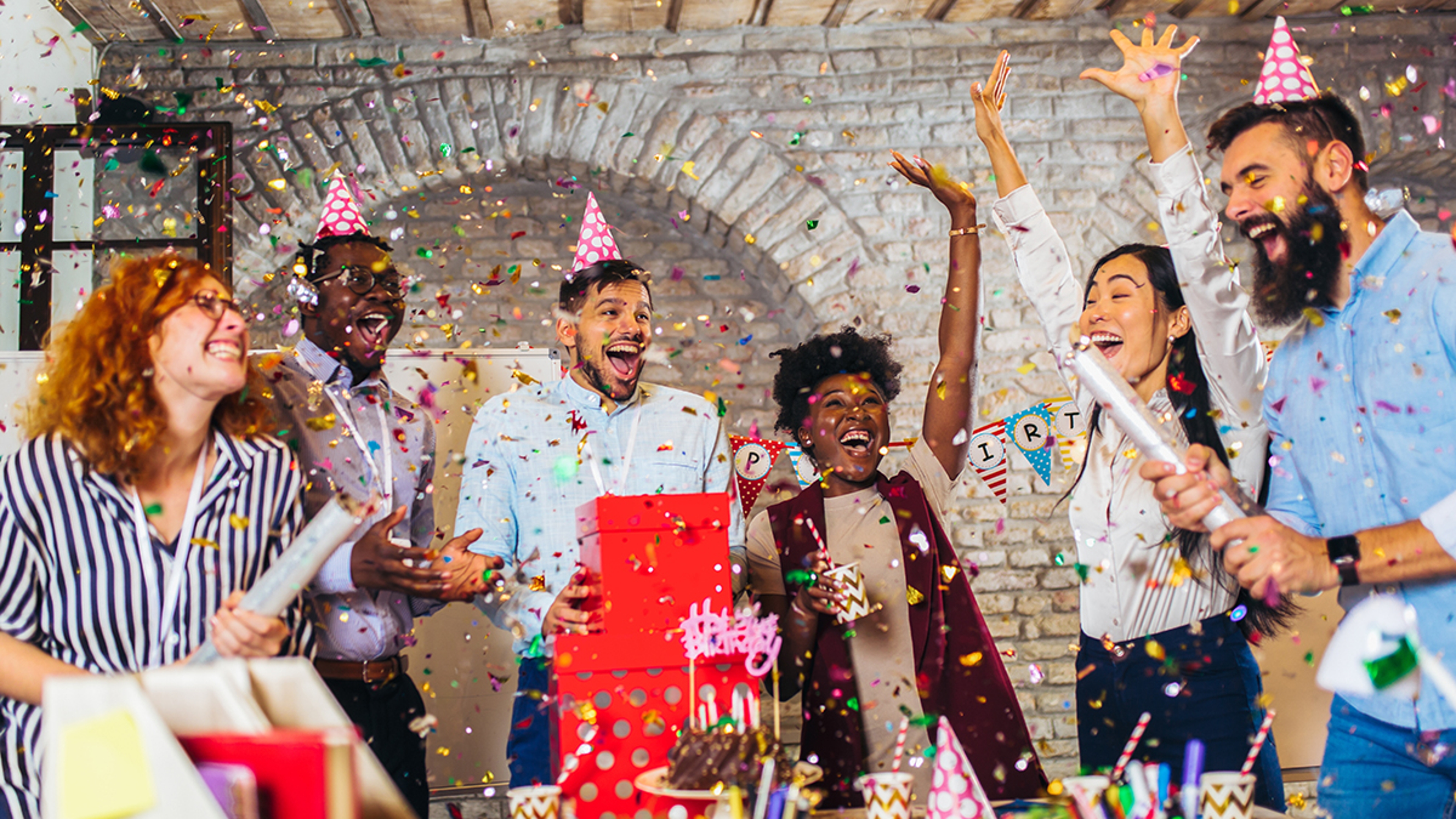 Article Cards Featured Image Businesspeople celebrating their colleagues birthday in office