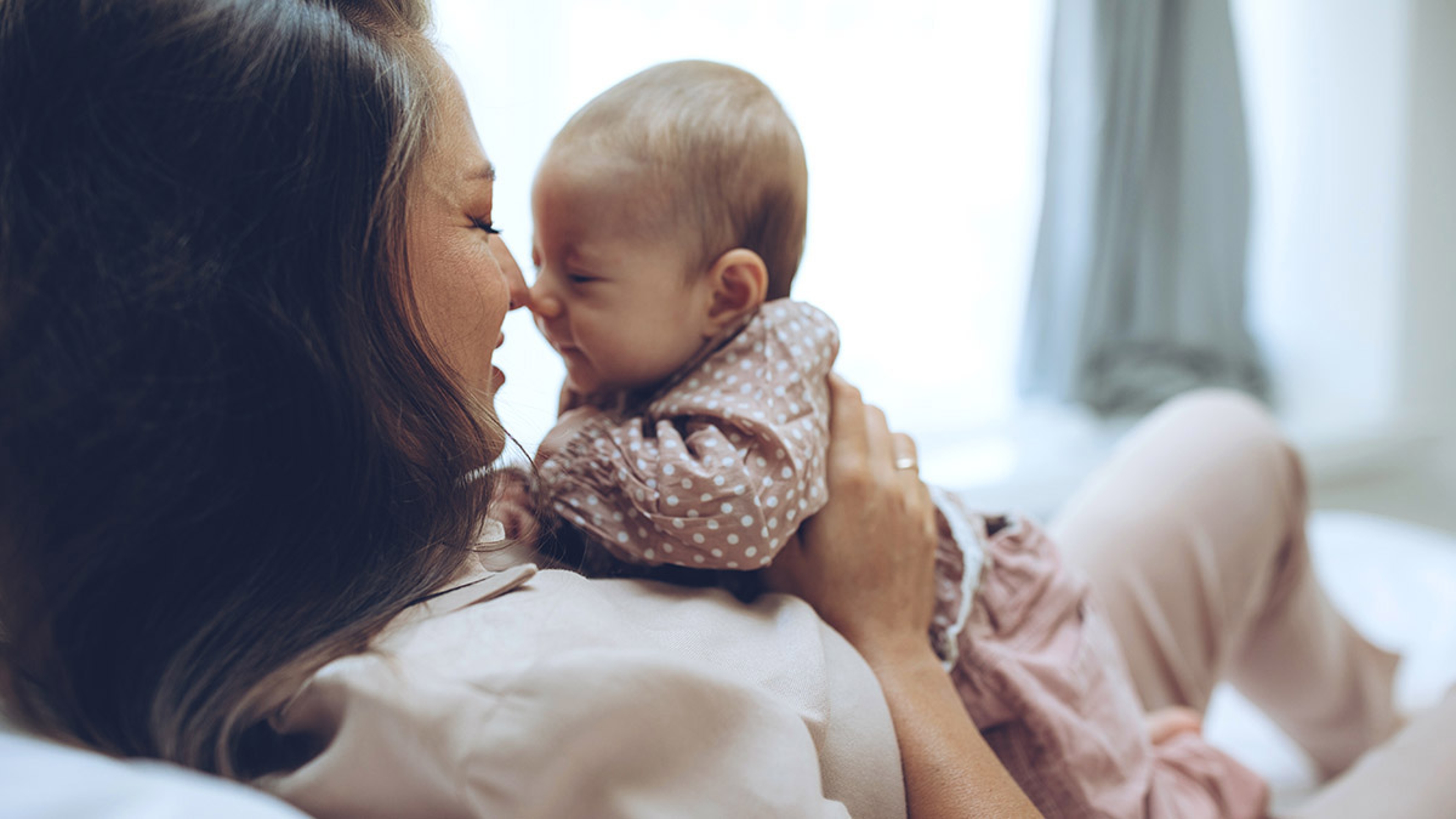 push present ideas mom snuggling with baby