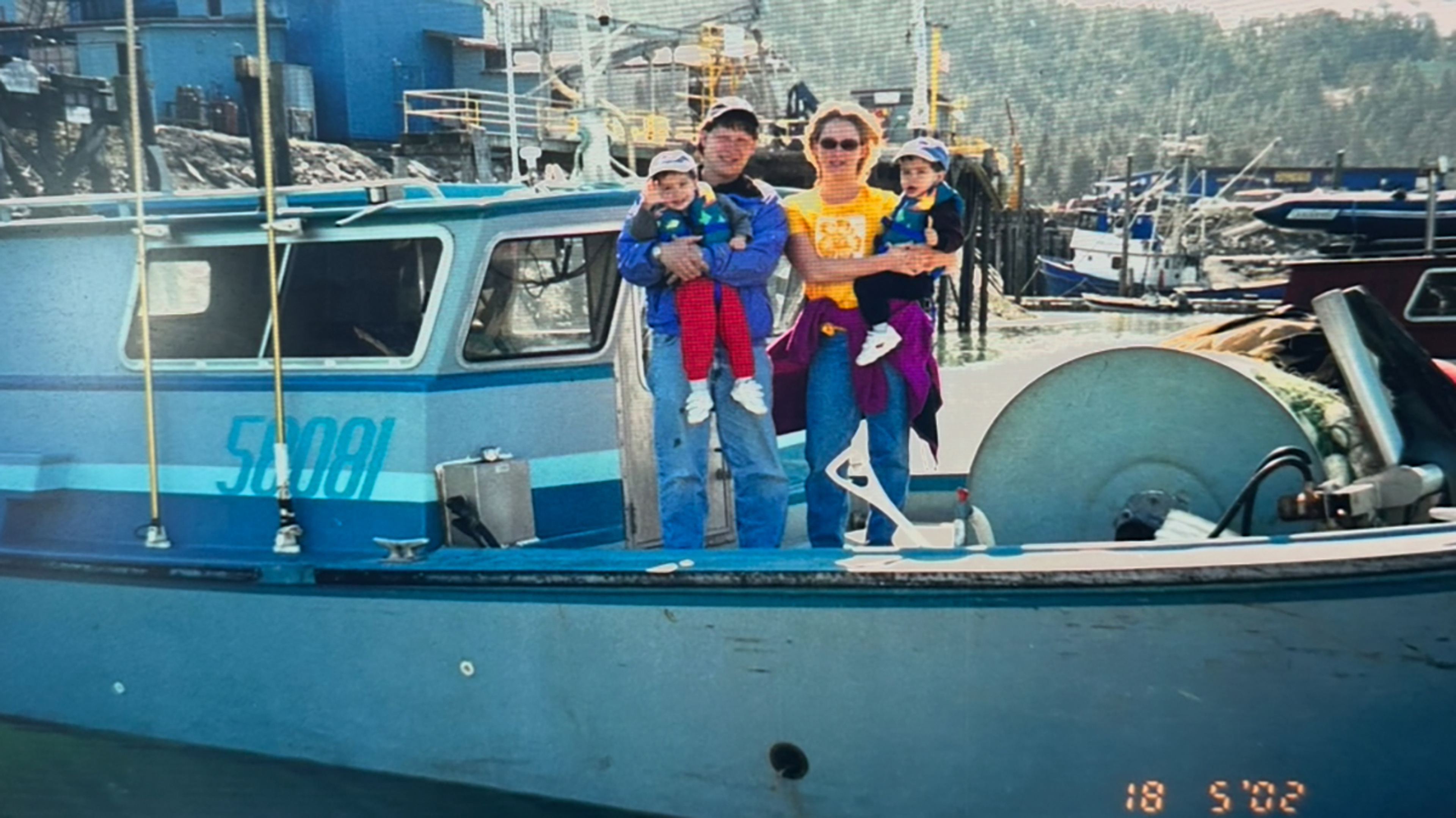 Fishing family on a boat.