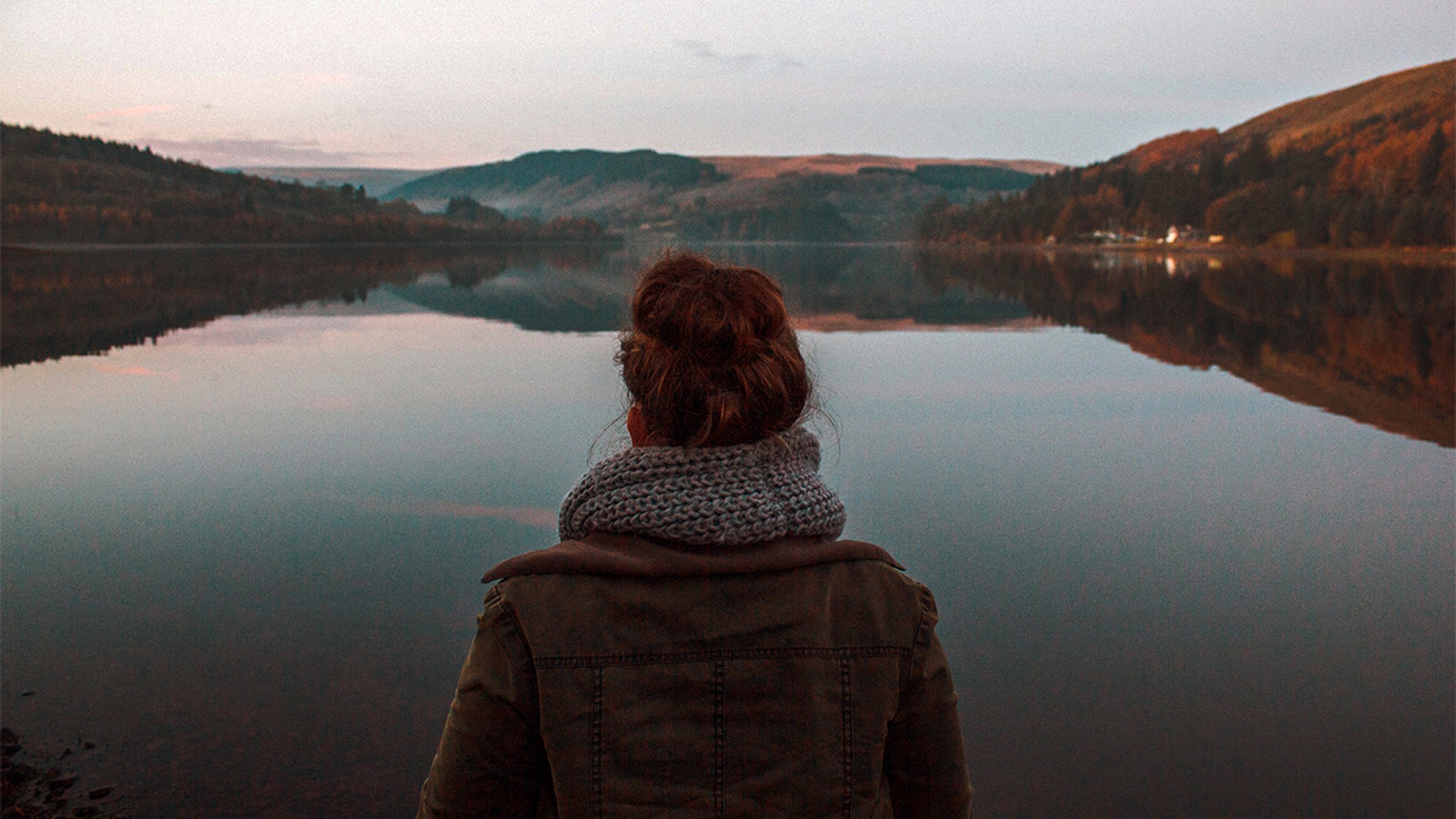 Practice Self Empathy person reflecting overlooking a lake