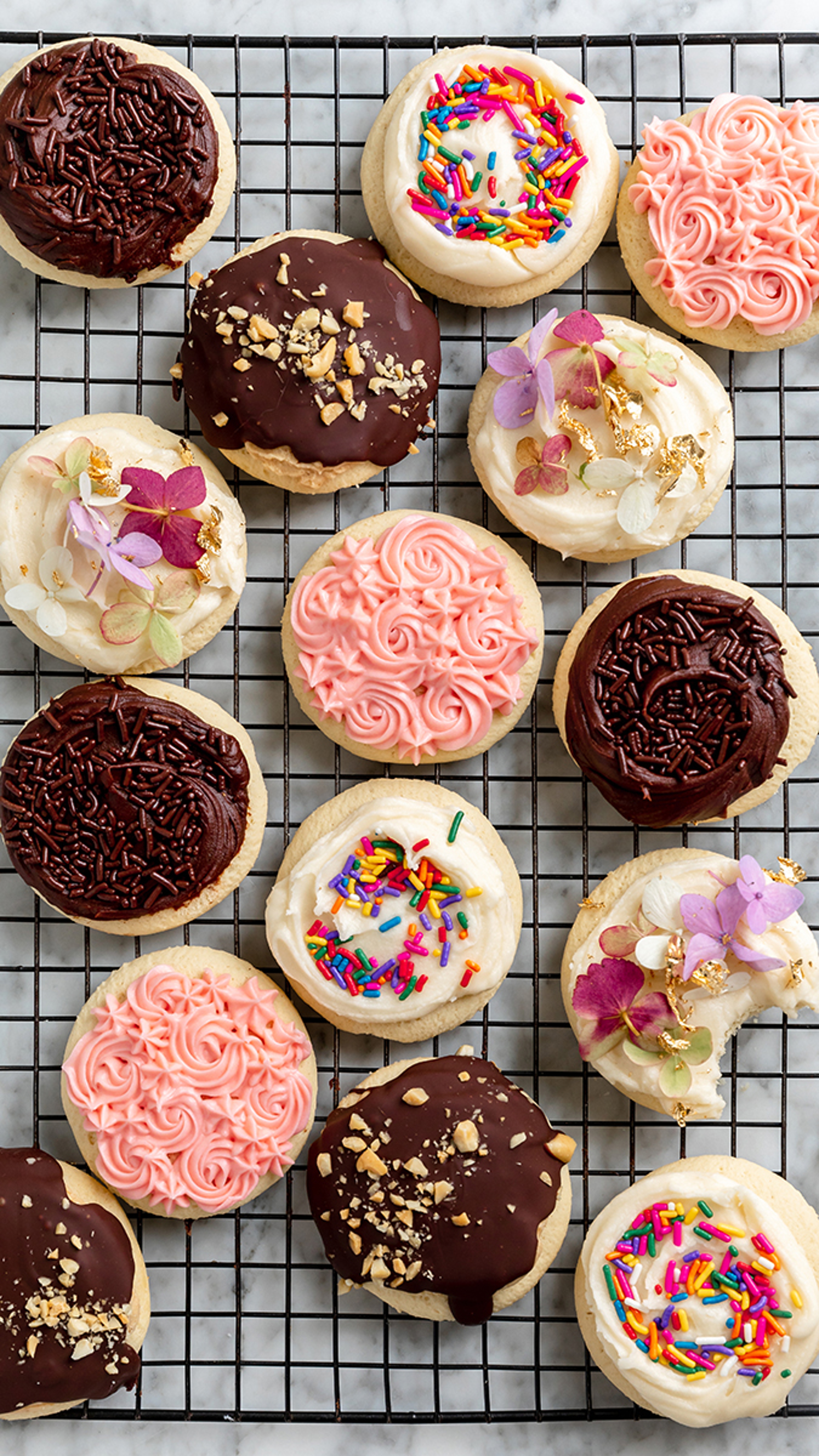 decorated cookies on cooking rack