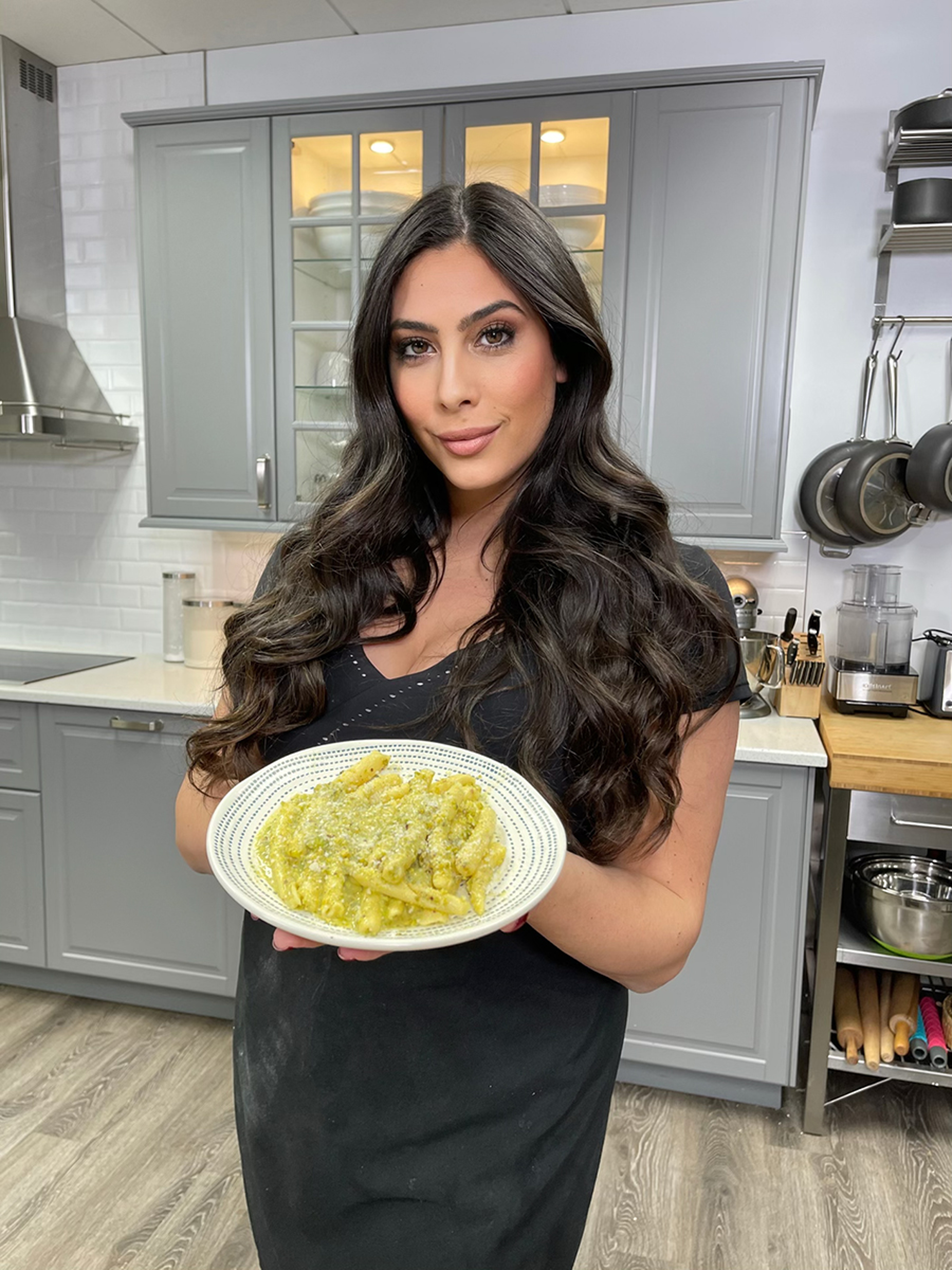 Valentine's Day at home with Janine Bruno holding a plate of pasta.