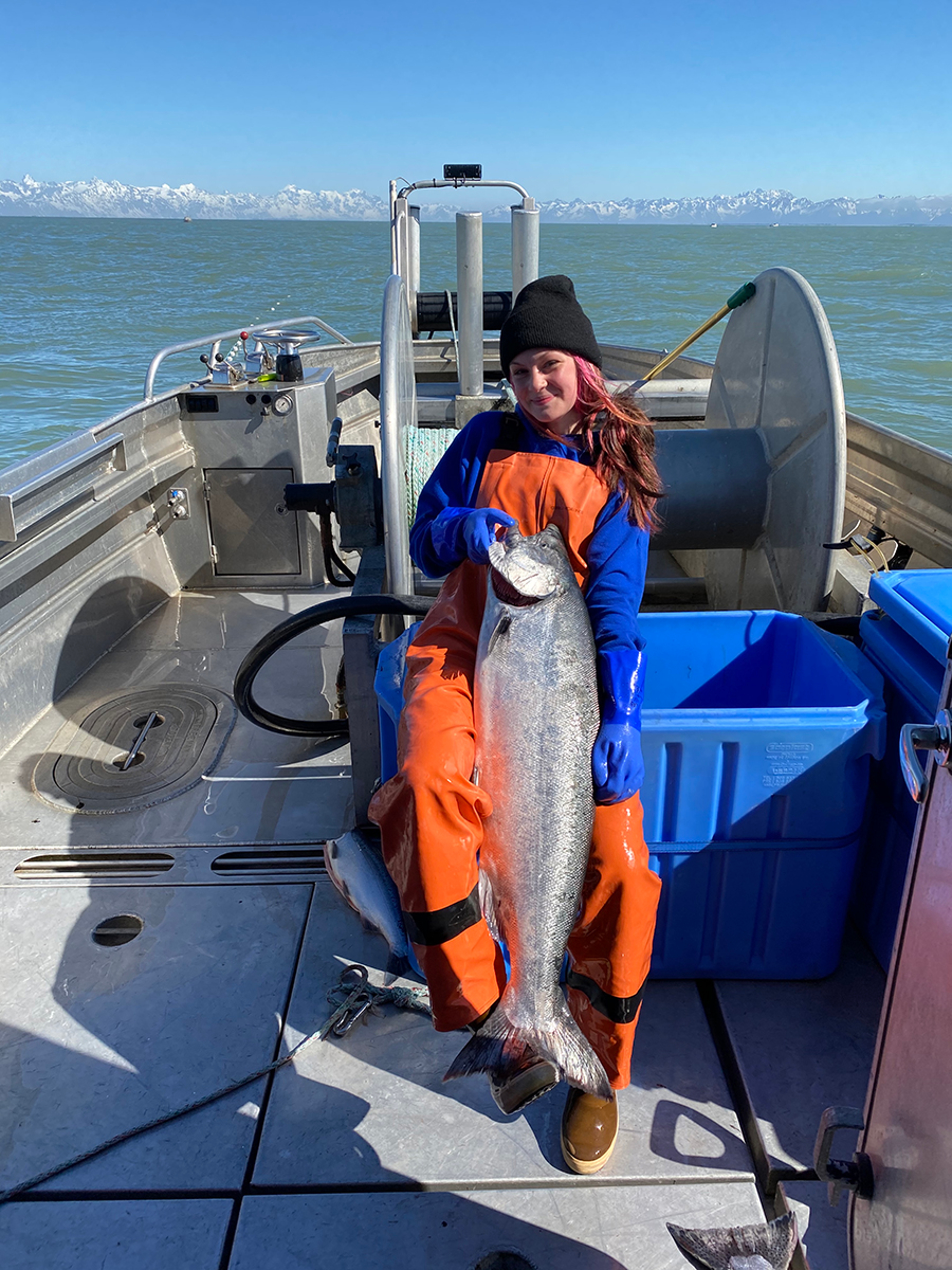 Fisherman holding king salmon.