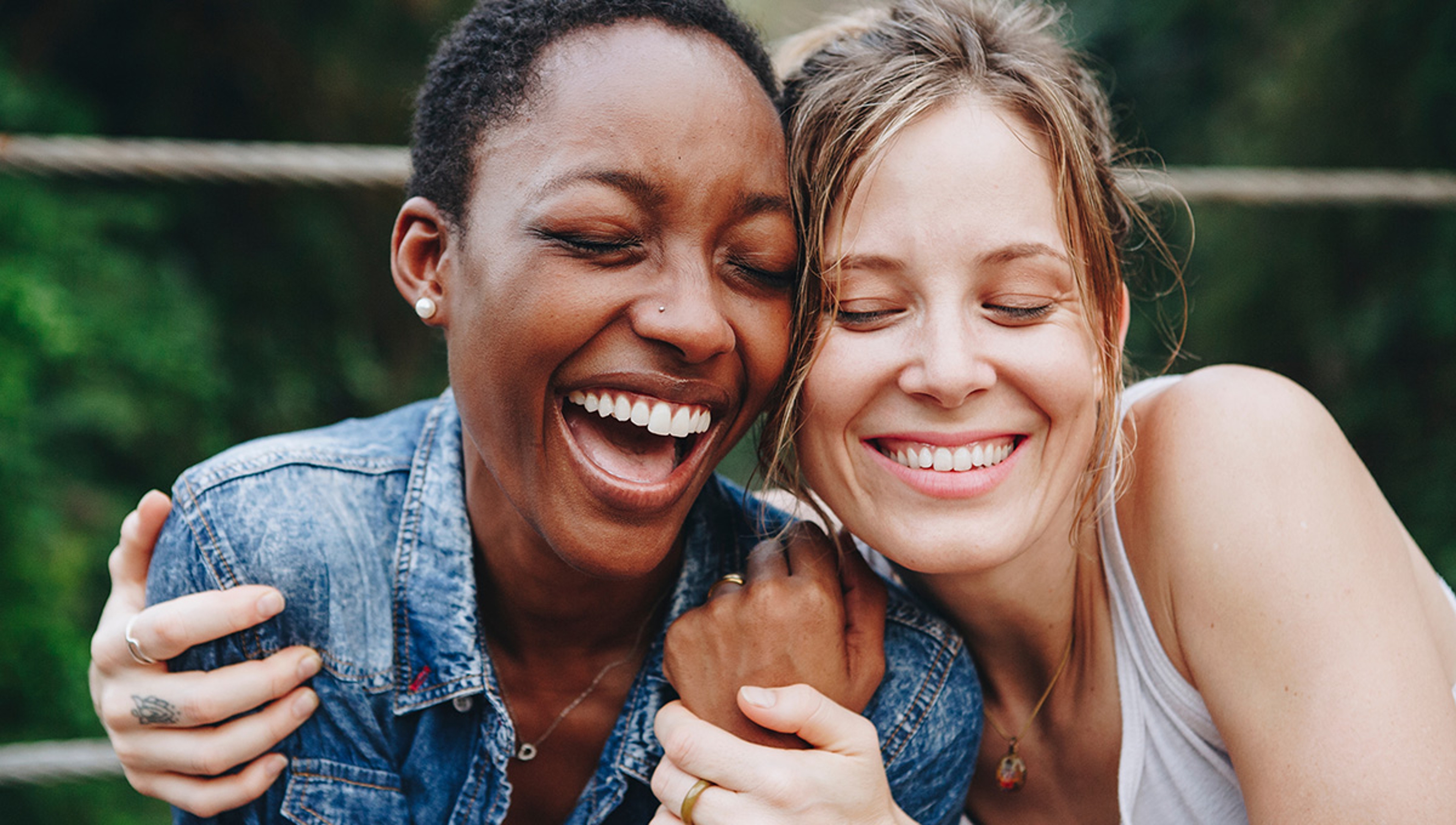 Happy friends holding each other