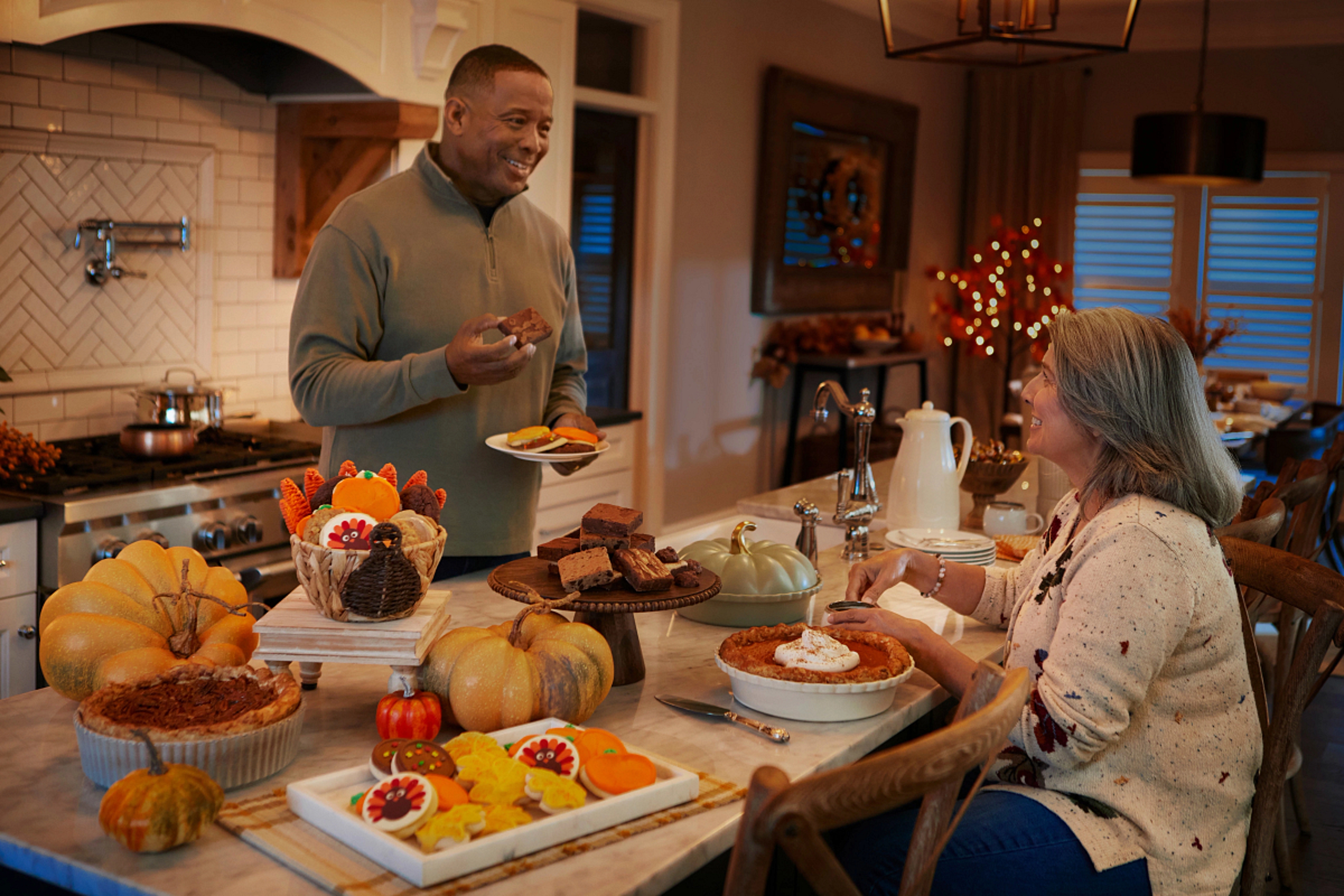 Adults eating Thanksgiving dessert expressing gratitude.