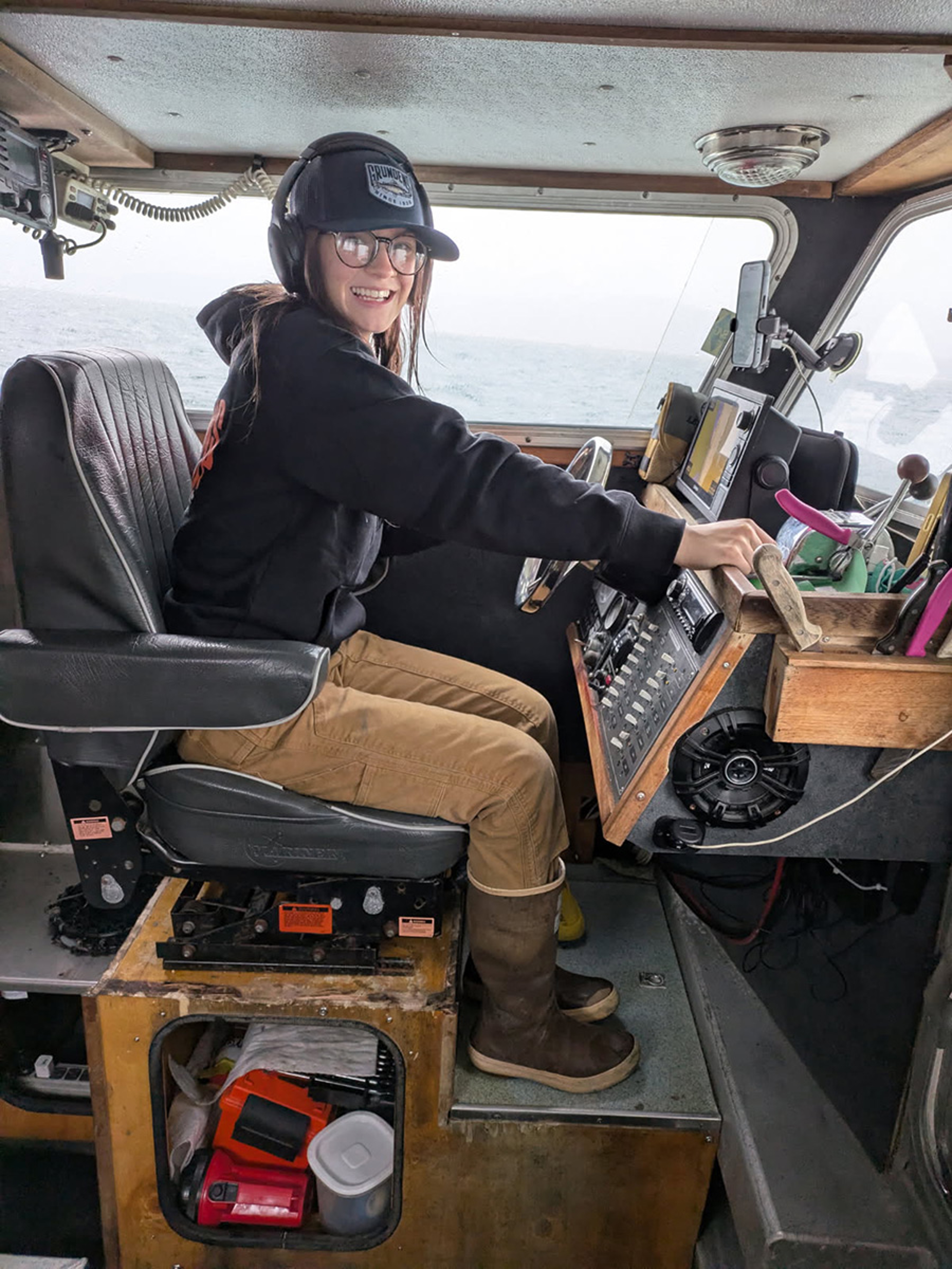 Kiley Burton, fisherman, driving a boat.
