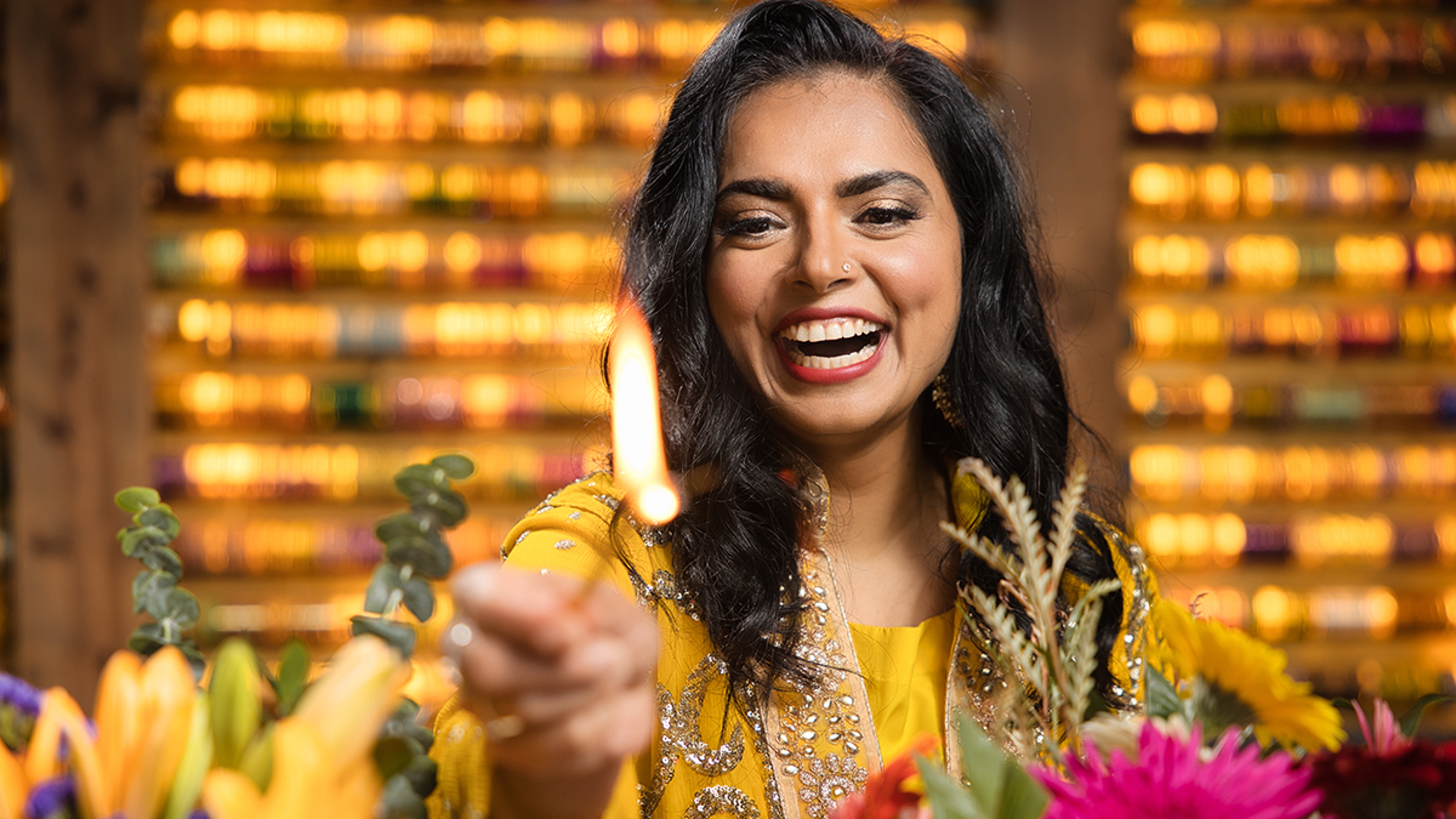 Maneet Chauhan lighting a candle as part of Diwali celebrations