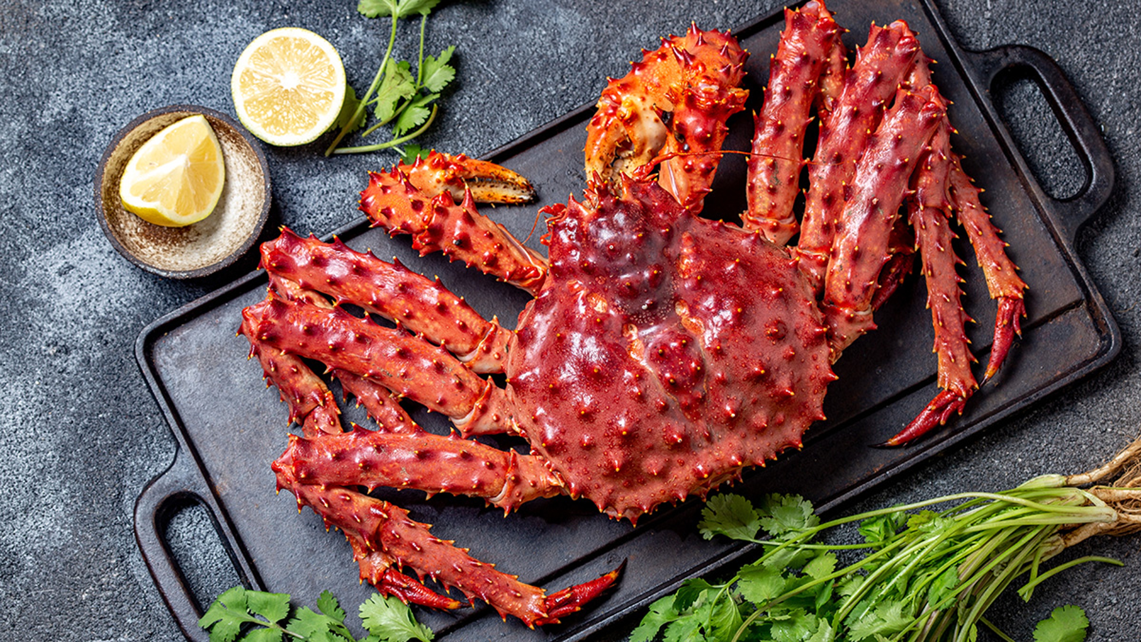 Red king crab on cooking griddle.