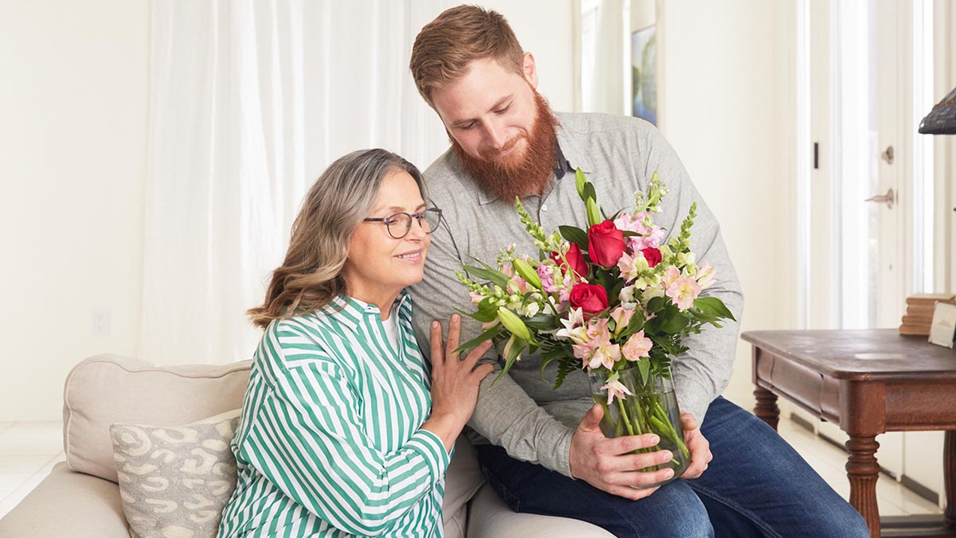 international womens day ideas with son giving mom flowers