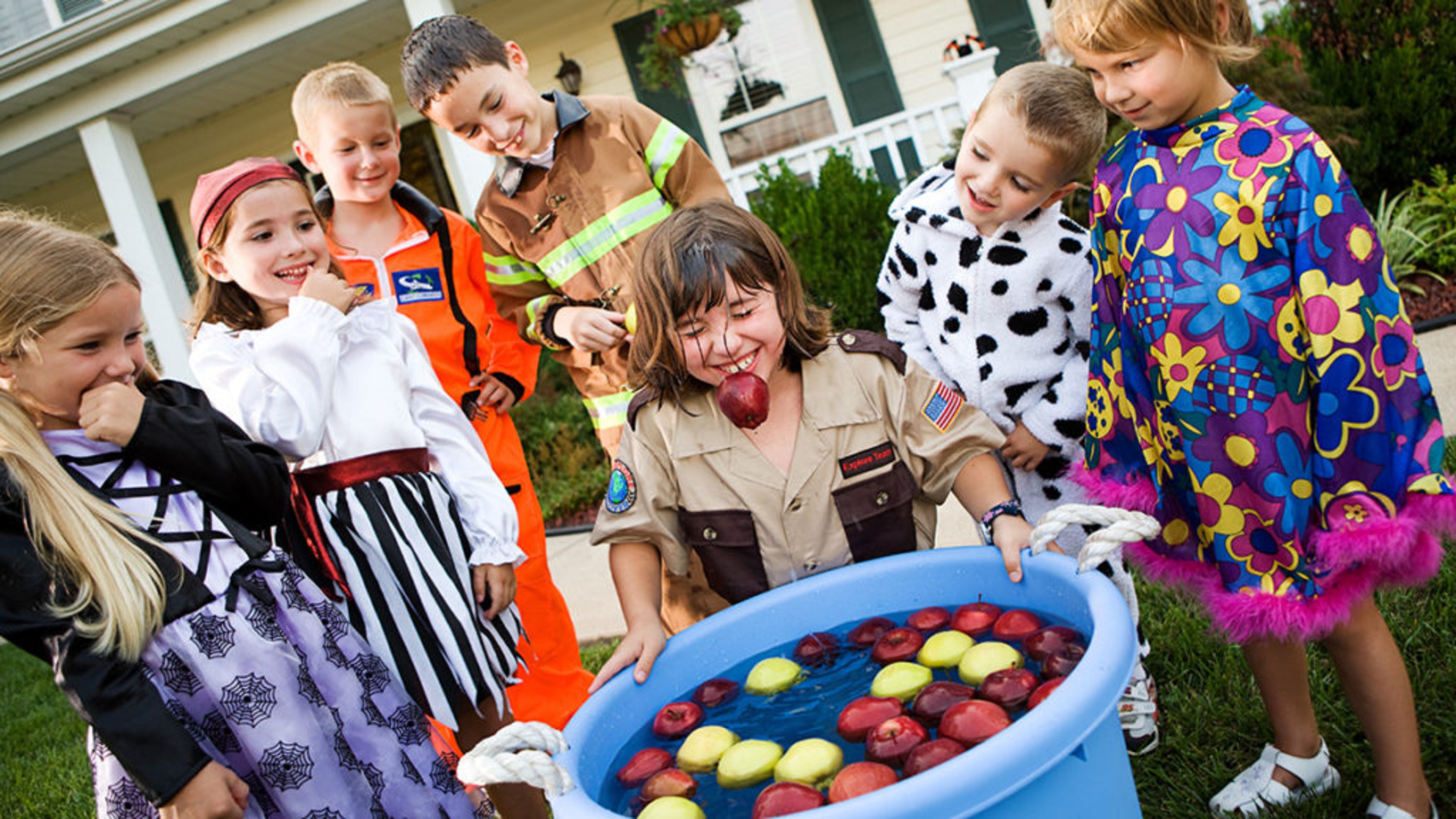 fall birthday ideas image children bobbing for apples