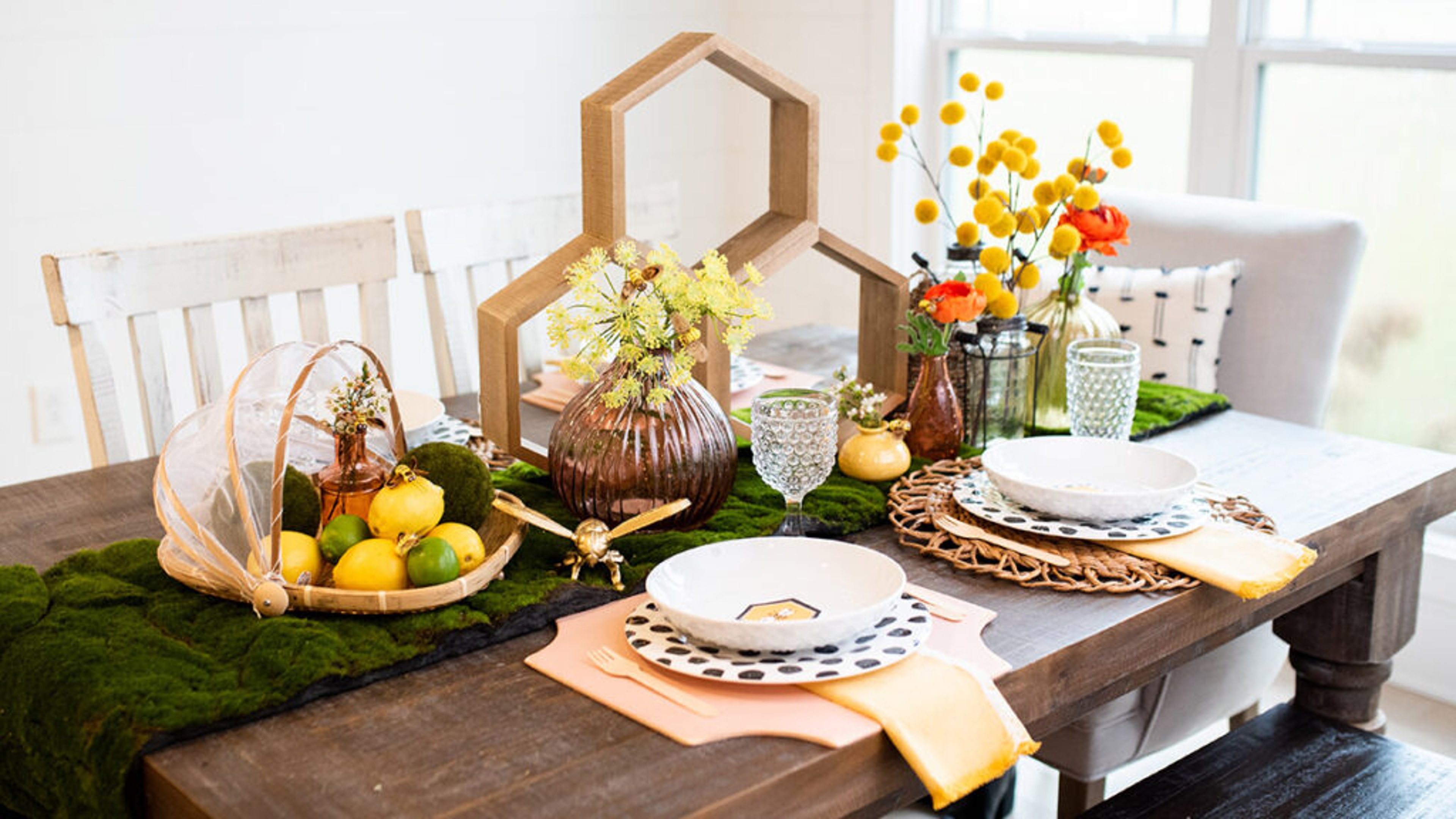 Spring birthday party spread with bees and flowers.