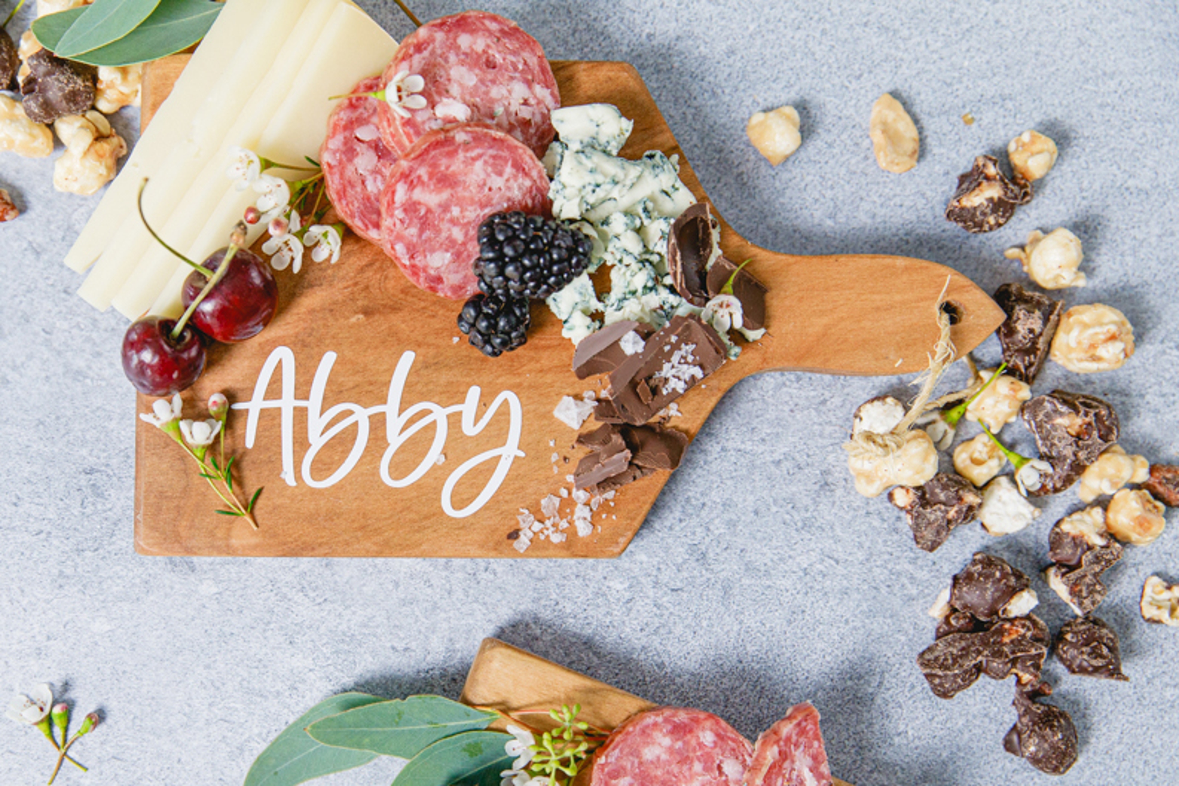 Host a movie night with a snack board with cheese, meat, and fruit.